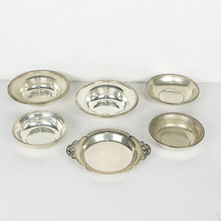 Six sterling bowls, including a Wallace bowl, a pair of bowls, a Webster tray fashioned in the Jensen style with leafy tendril handle..