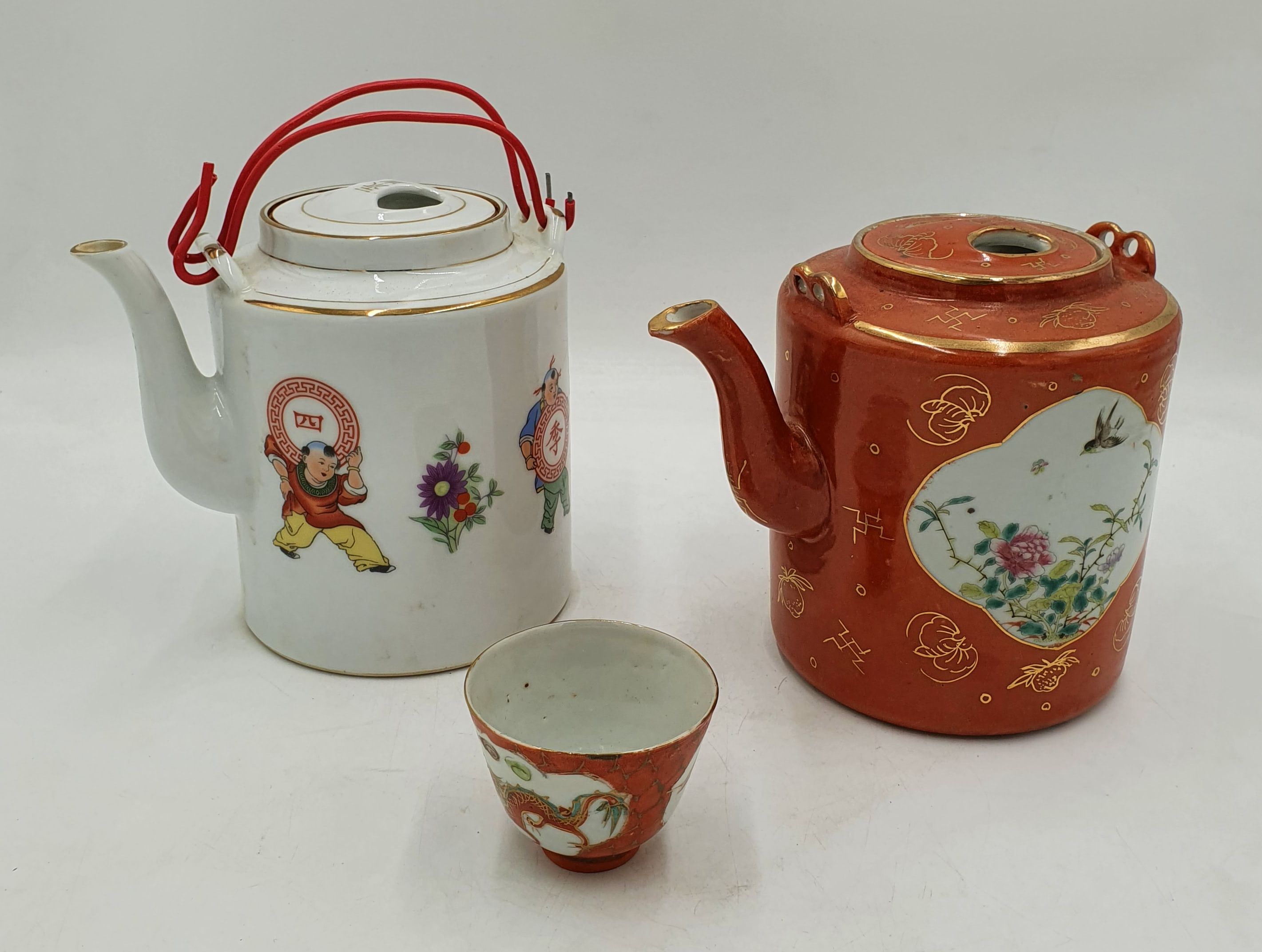 Two Chinese Travelling Teapots In Baskets
