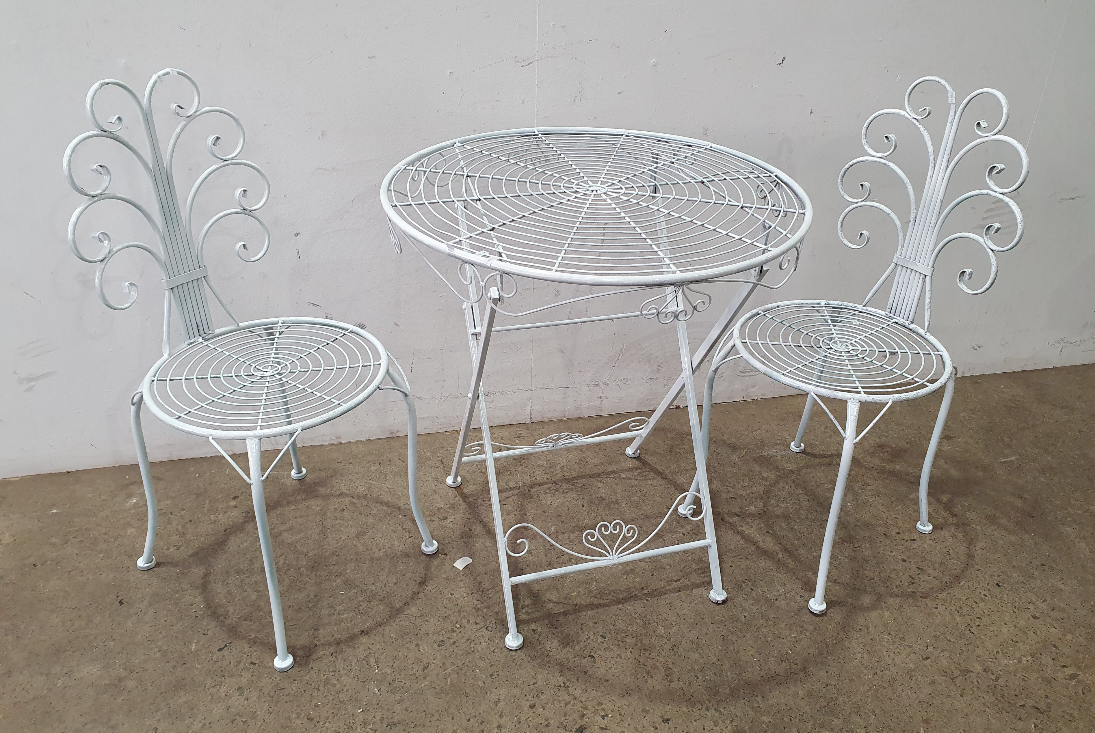 A Three Piece Wire Frame Outdoor Setting