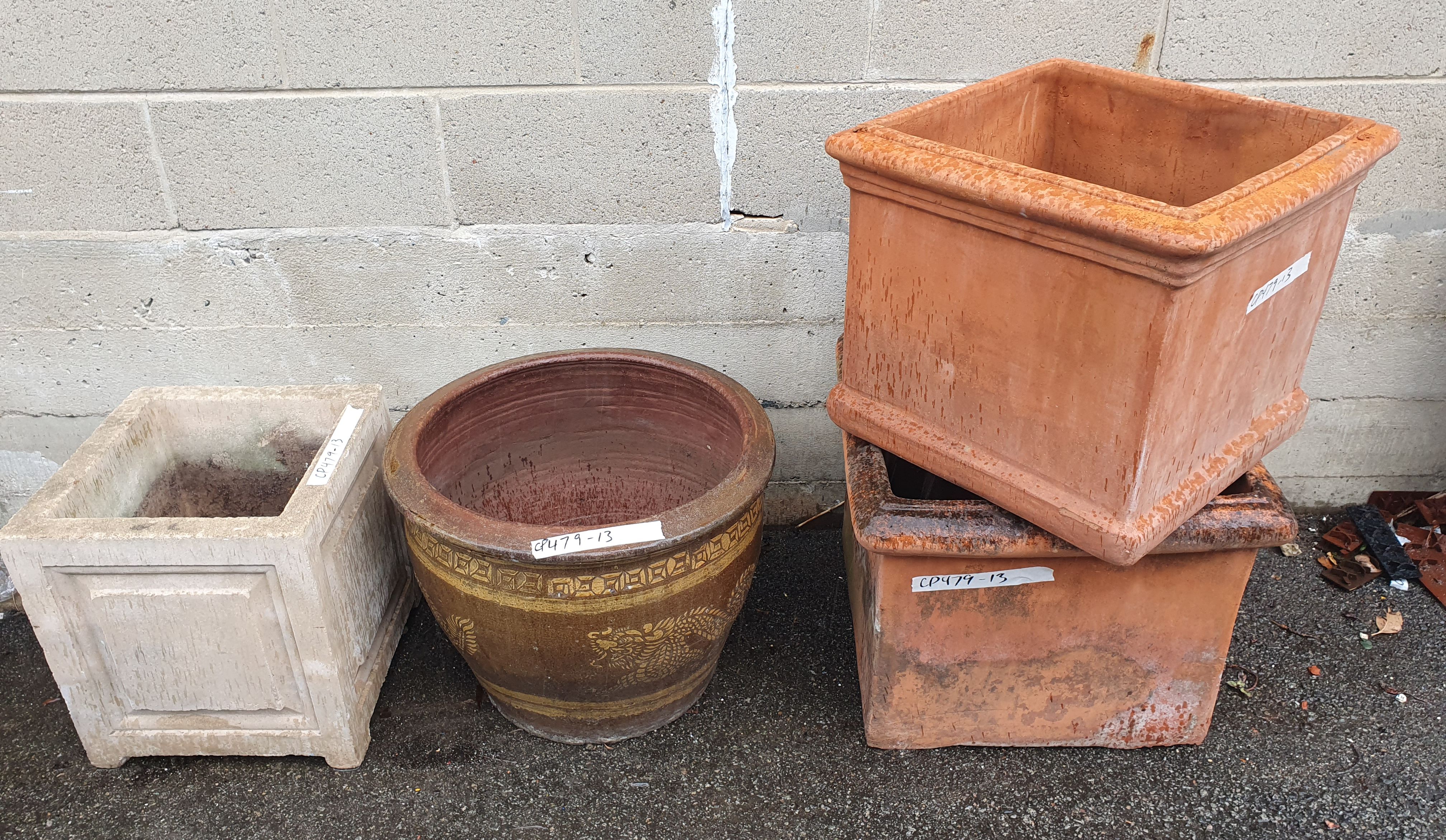 1123 · A GROUP OF FOUR LARGE GARDEN POTS