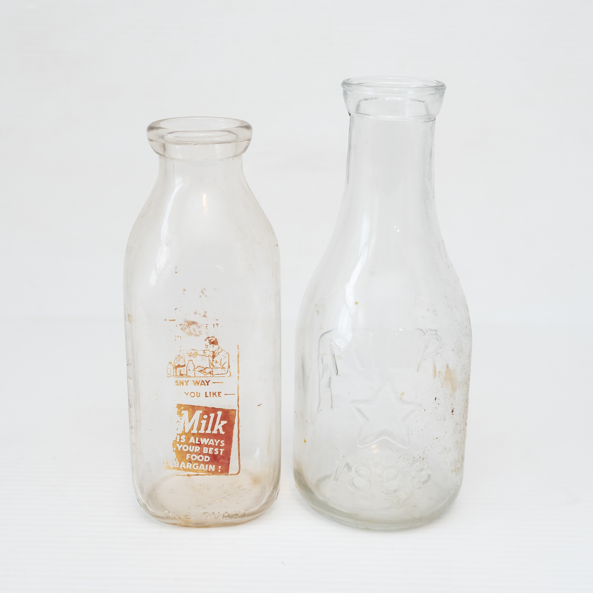 Two Vintage Glass Milk Bottles Harritt Group, Inc
