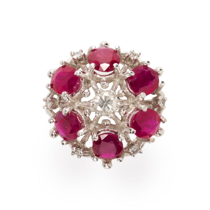 A Burma ruby, diamond and fourteen karat white gold ring