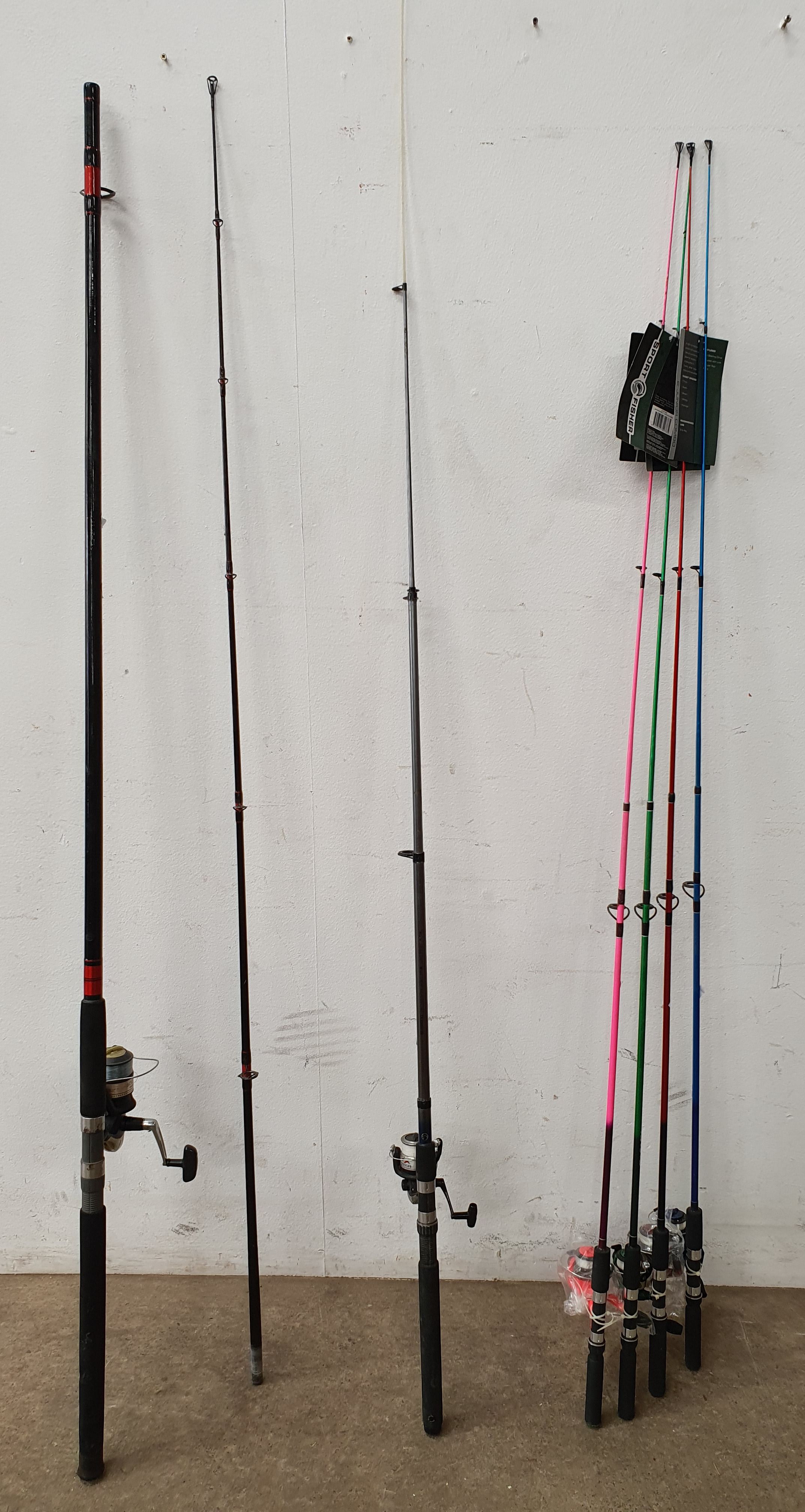 A GROUP OF FISHING RODS