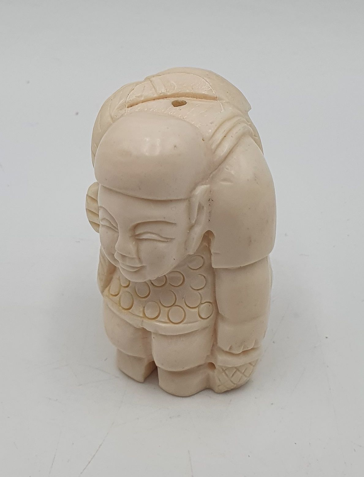 521 · AN ASIAN CARVED FIGURE OF A FISHERMAN