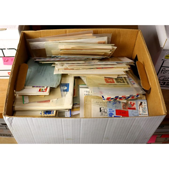 Banker box filled with a wide range of US and foreign covers