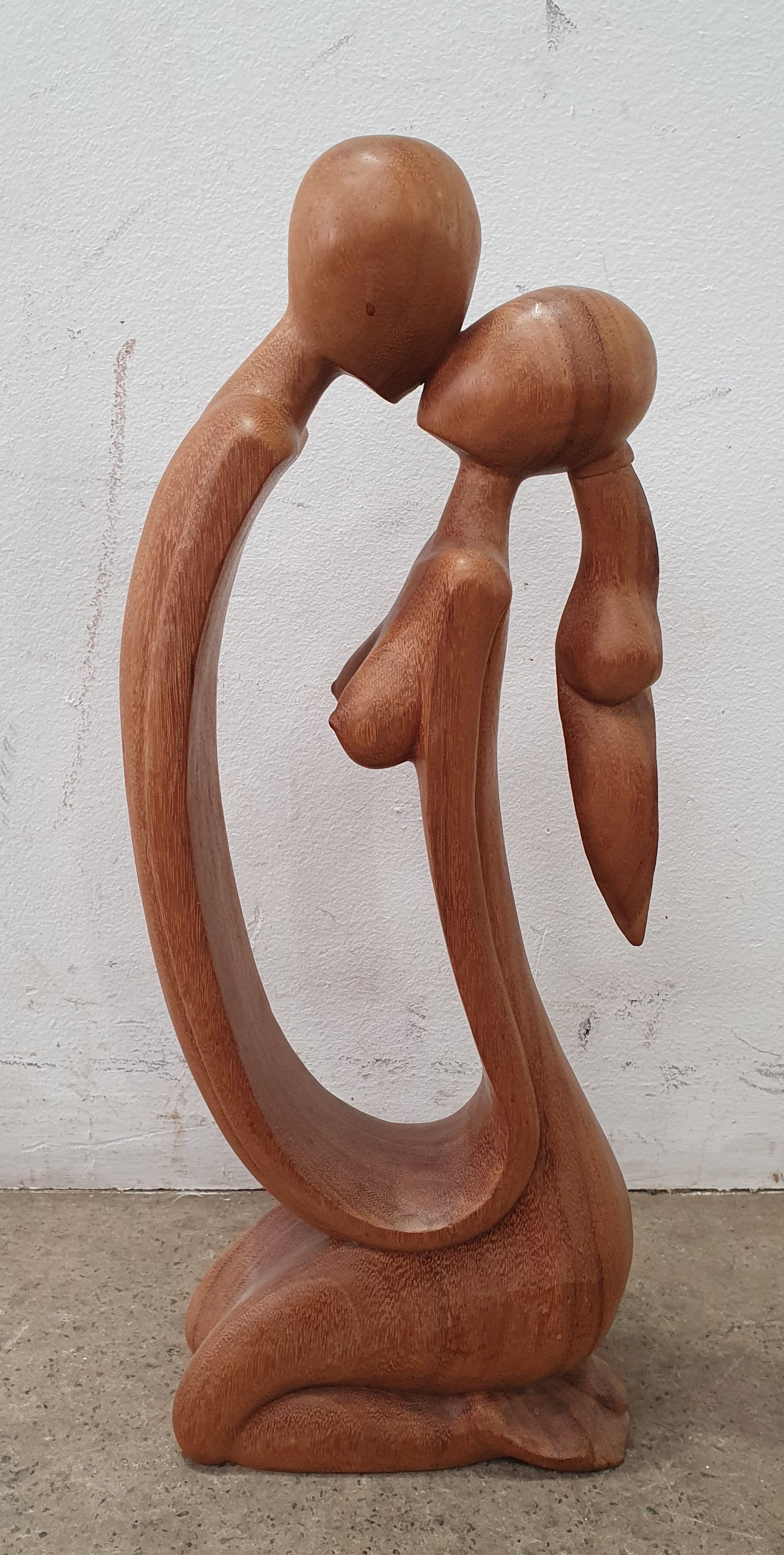 A TIMBER CARVED STATUE