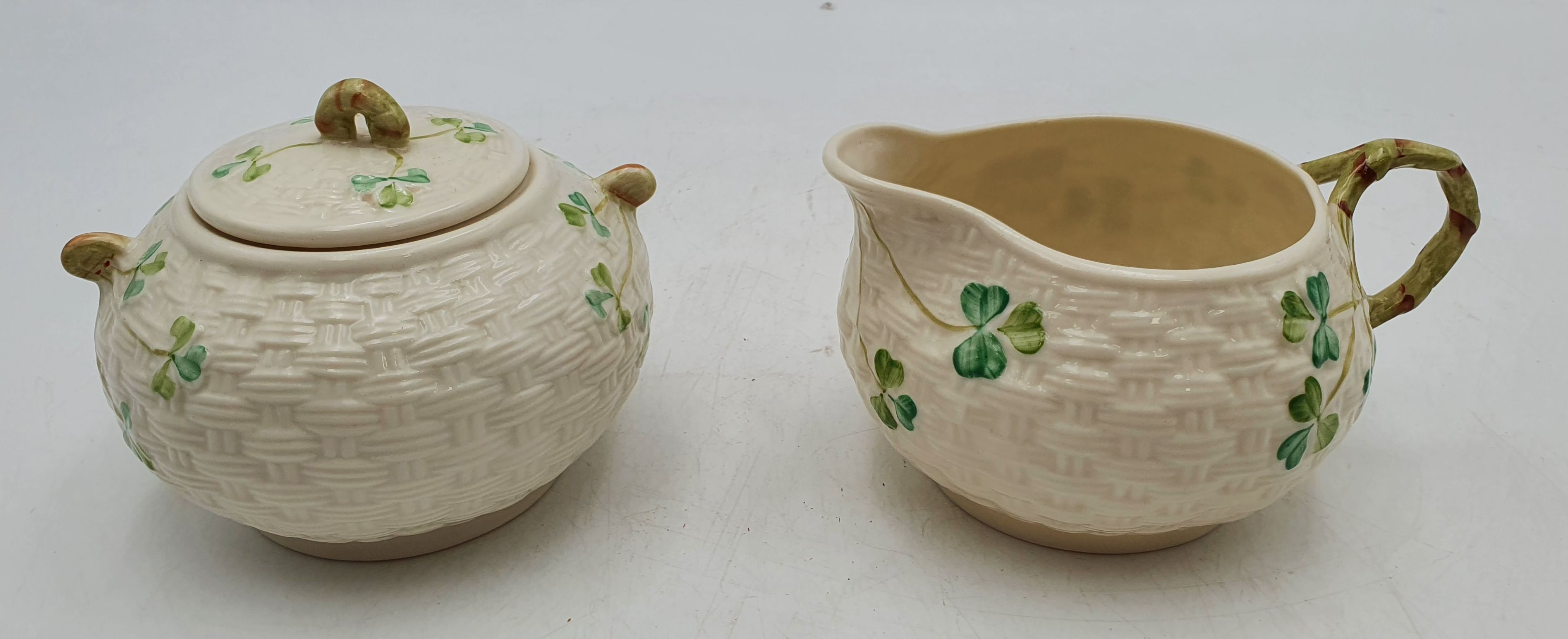 A Beleek 'Shamrock' Covered Sugar Bowl And Milk Jug