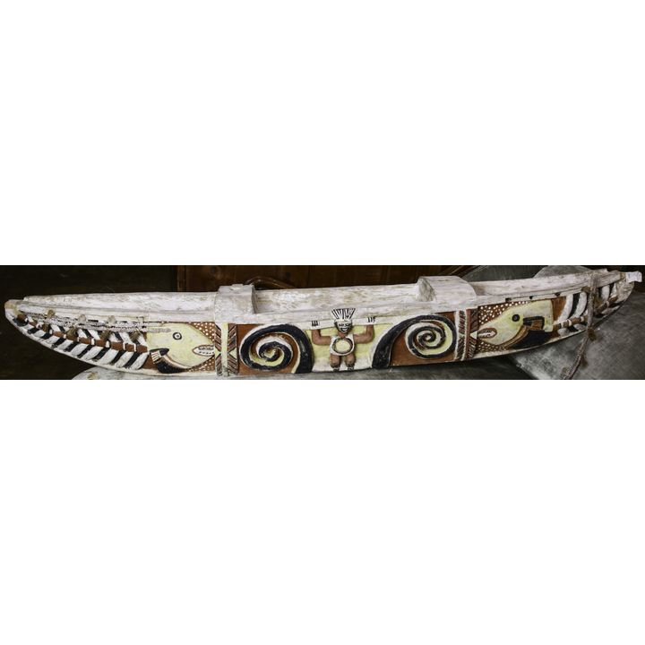 Large wood carved and polychrome decorated ethnographic canoe