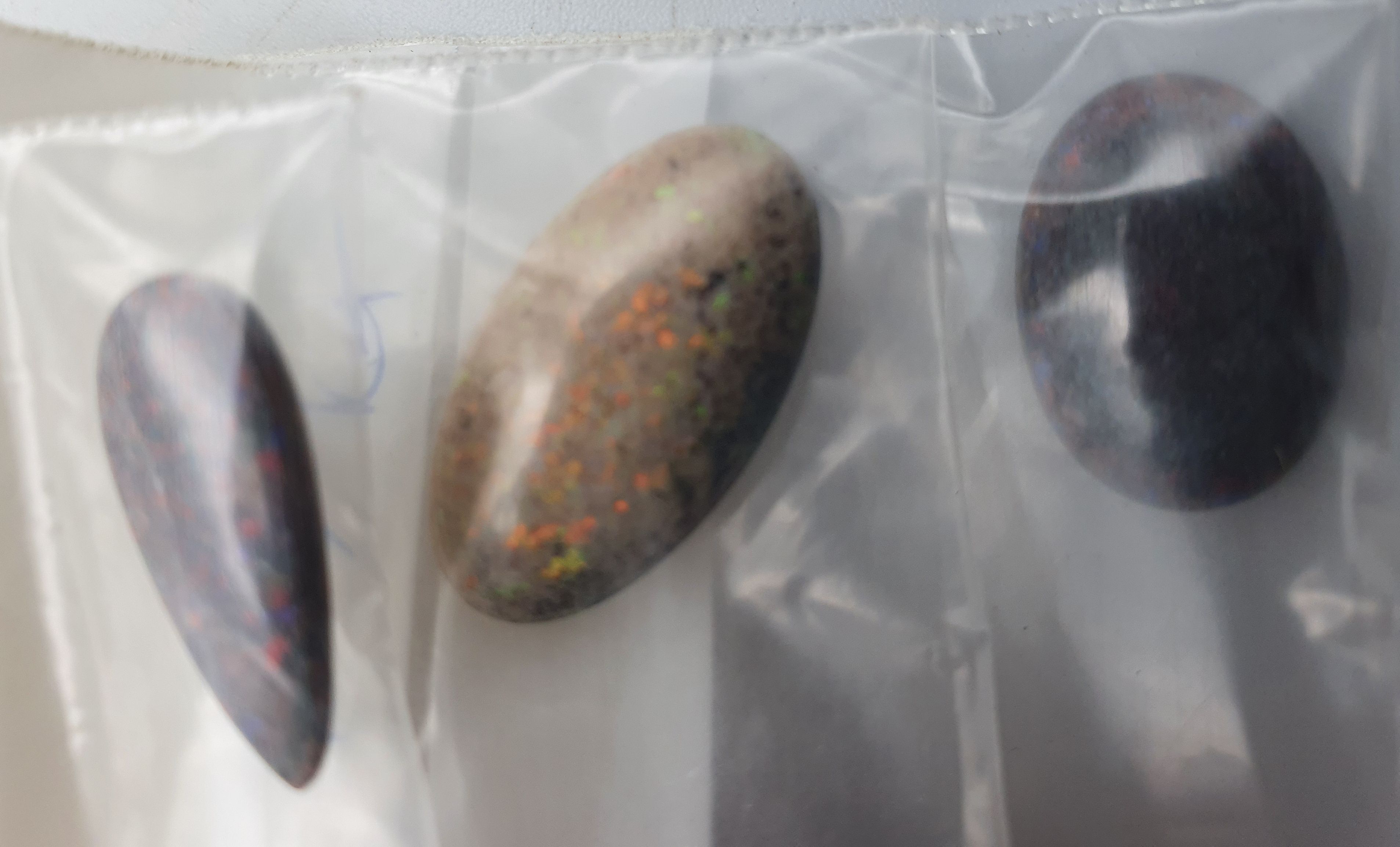 317 · THREE VARIOUS OPALS