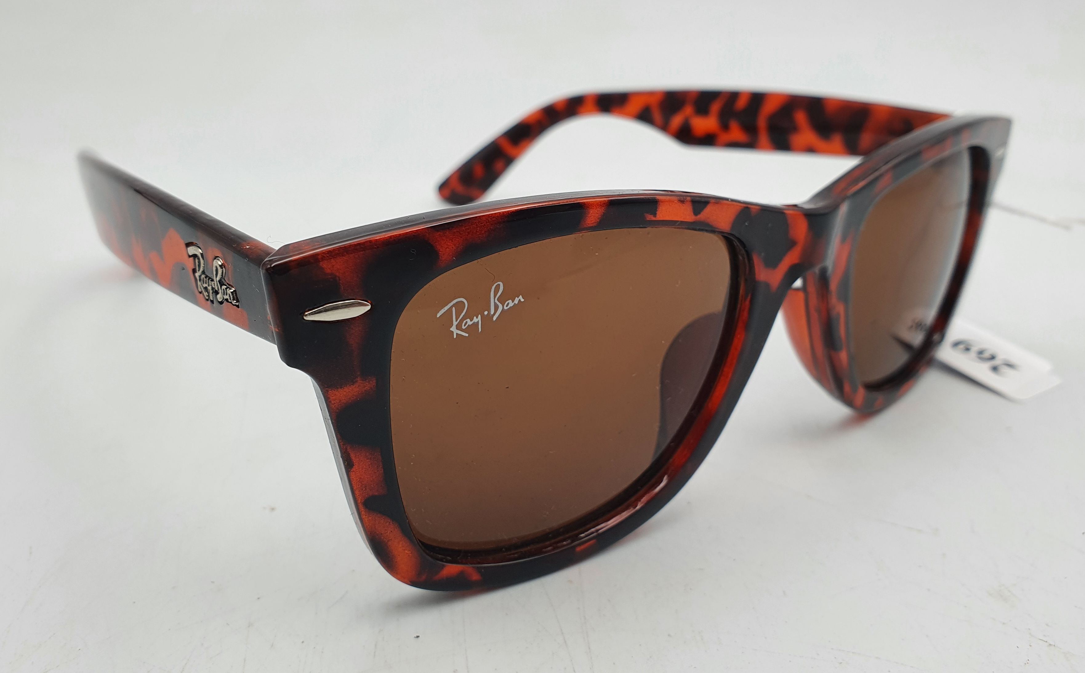 A PAIR OF RAYBAN SUNGLASSES