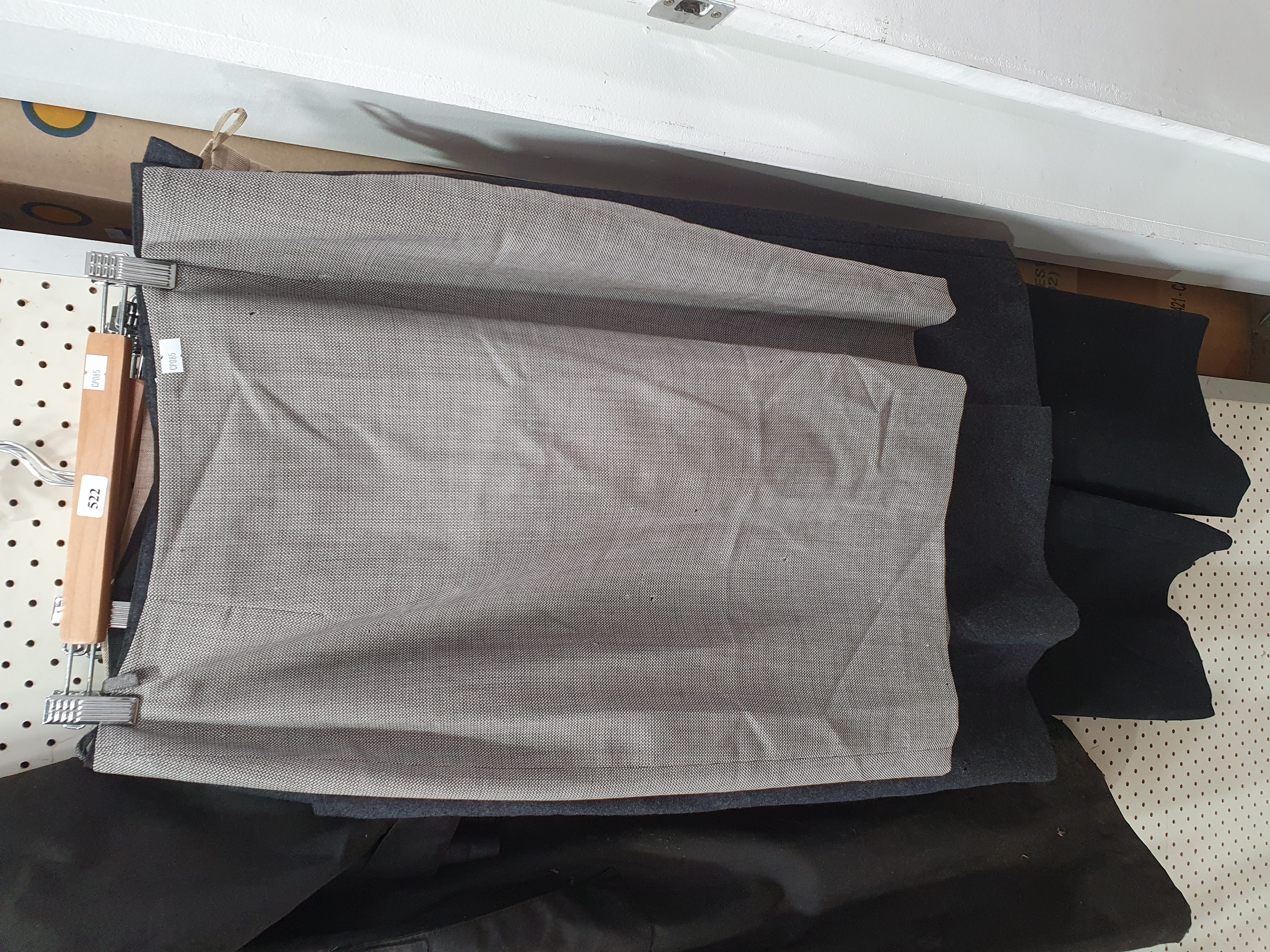 A GROUP OF WOMEN'S TROUSERS AND SKIRTS