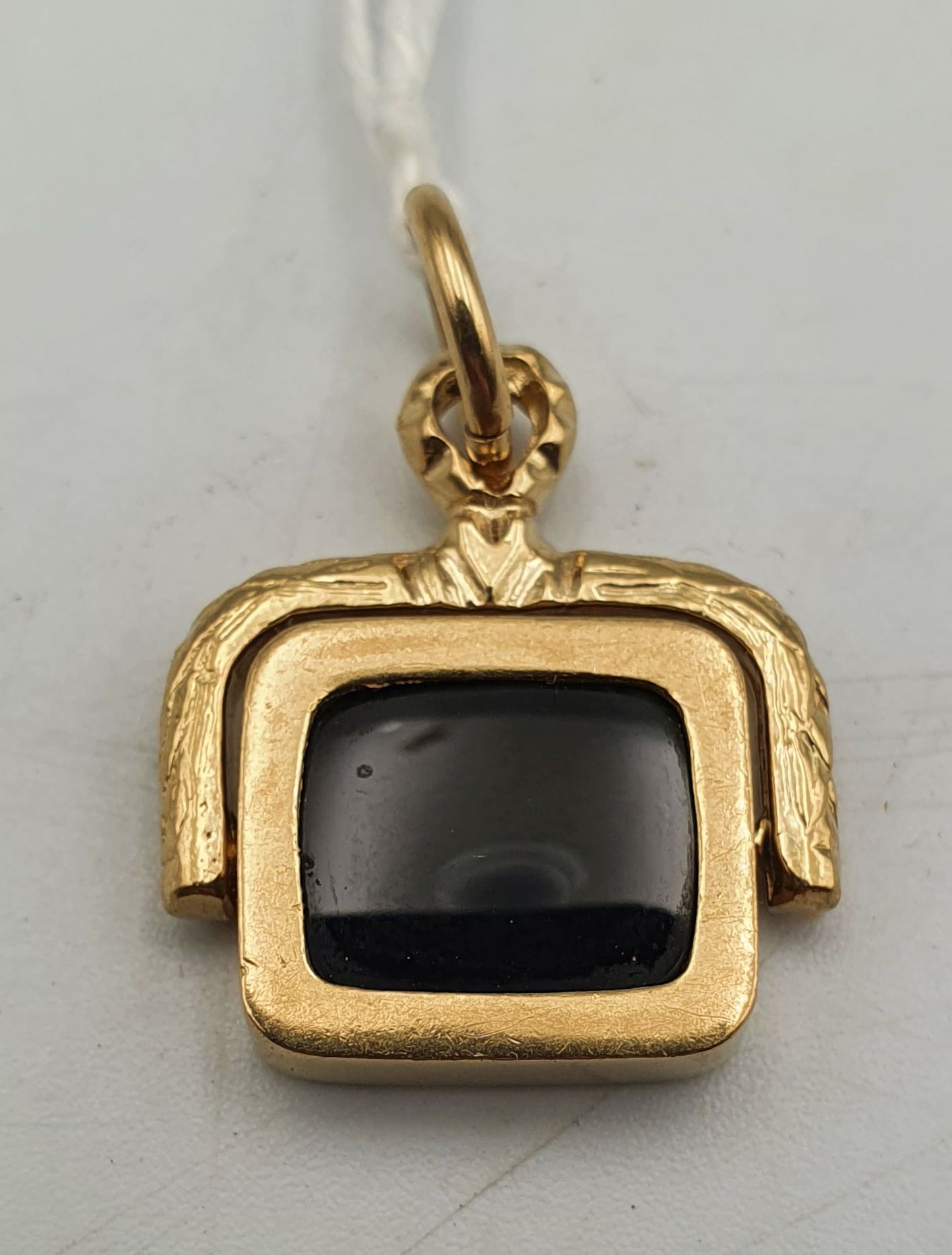 A 9ct And Onyx Spinning Silver Fob Pendant