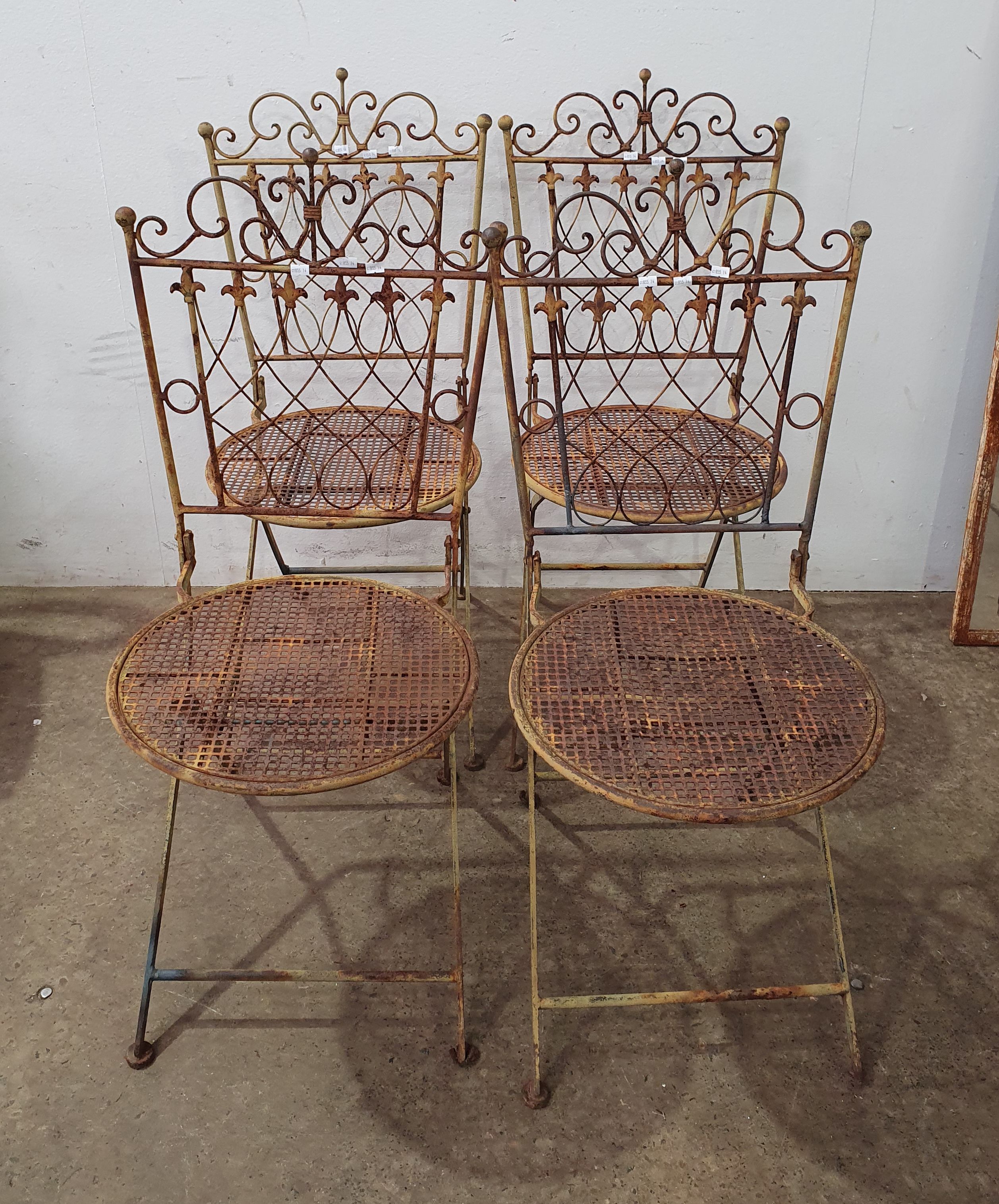 1068 · A SET OF FOUR METAL CHAIRS