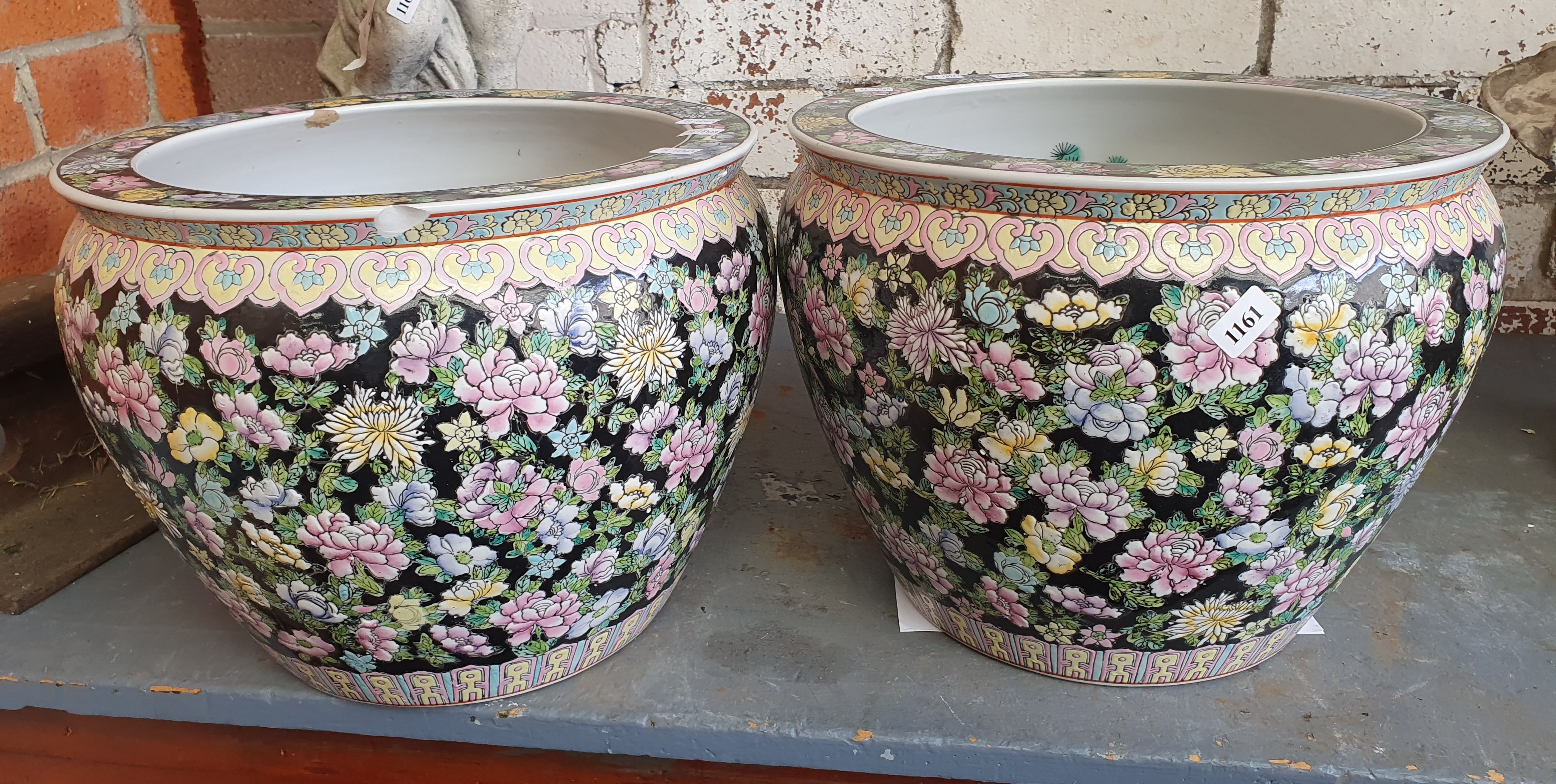 1161 · A PAIR OF FLORAL POTS