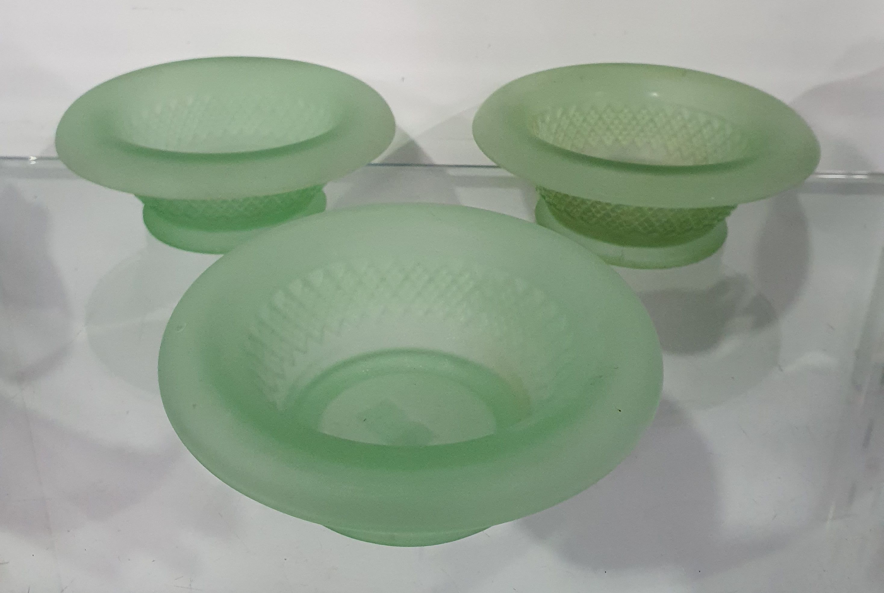 683 · A TRIO OF ART DECO GREEN FROSTED DEPRESSION GLASS FLOAT BOWLS