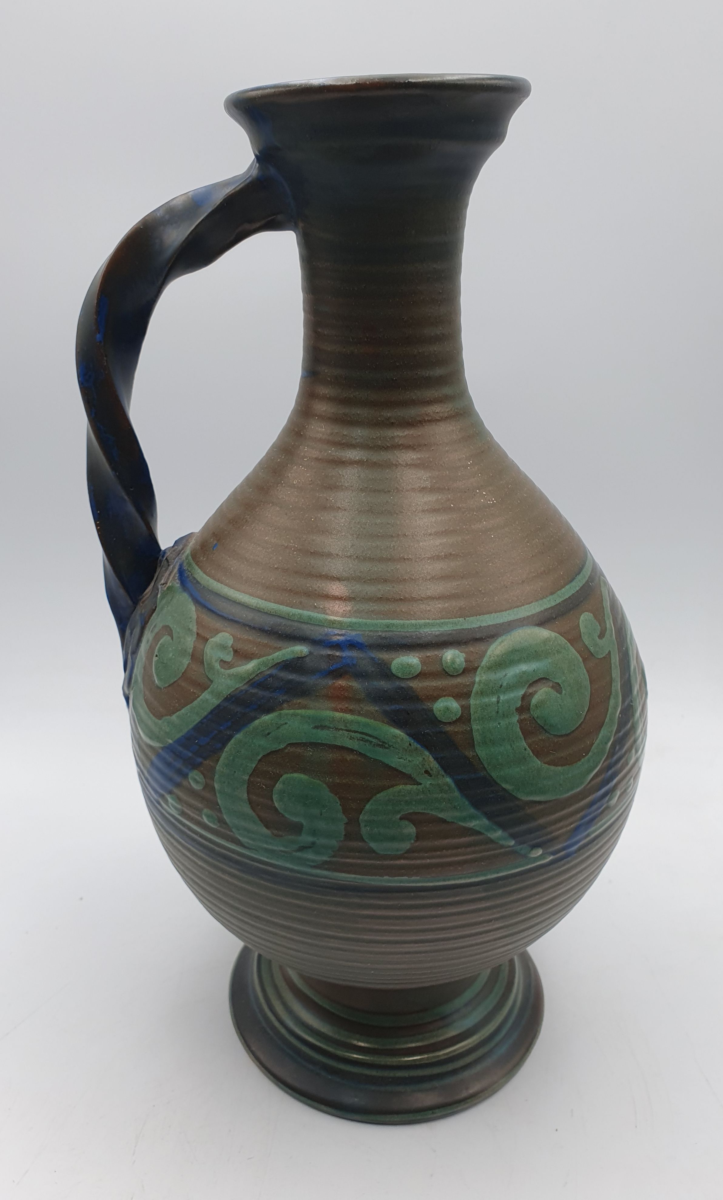 142 · AN EARLY 20th CENTURY EUROPEAN POTTERY JUG