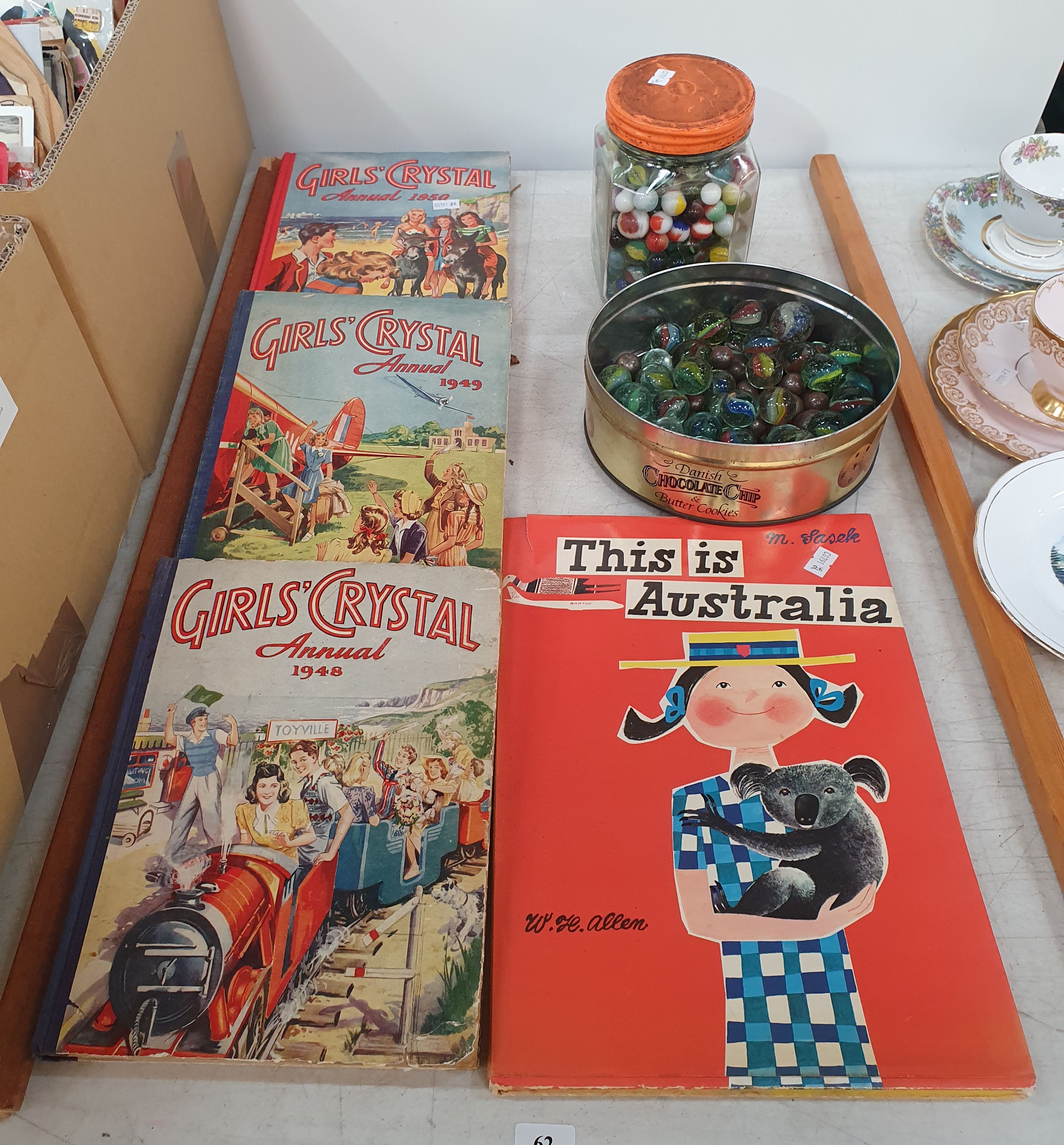 62 · A MARBLE COLLECTION AND FOUR CHILDRENS BOOKS