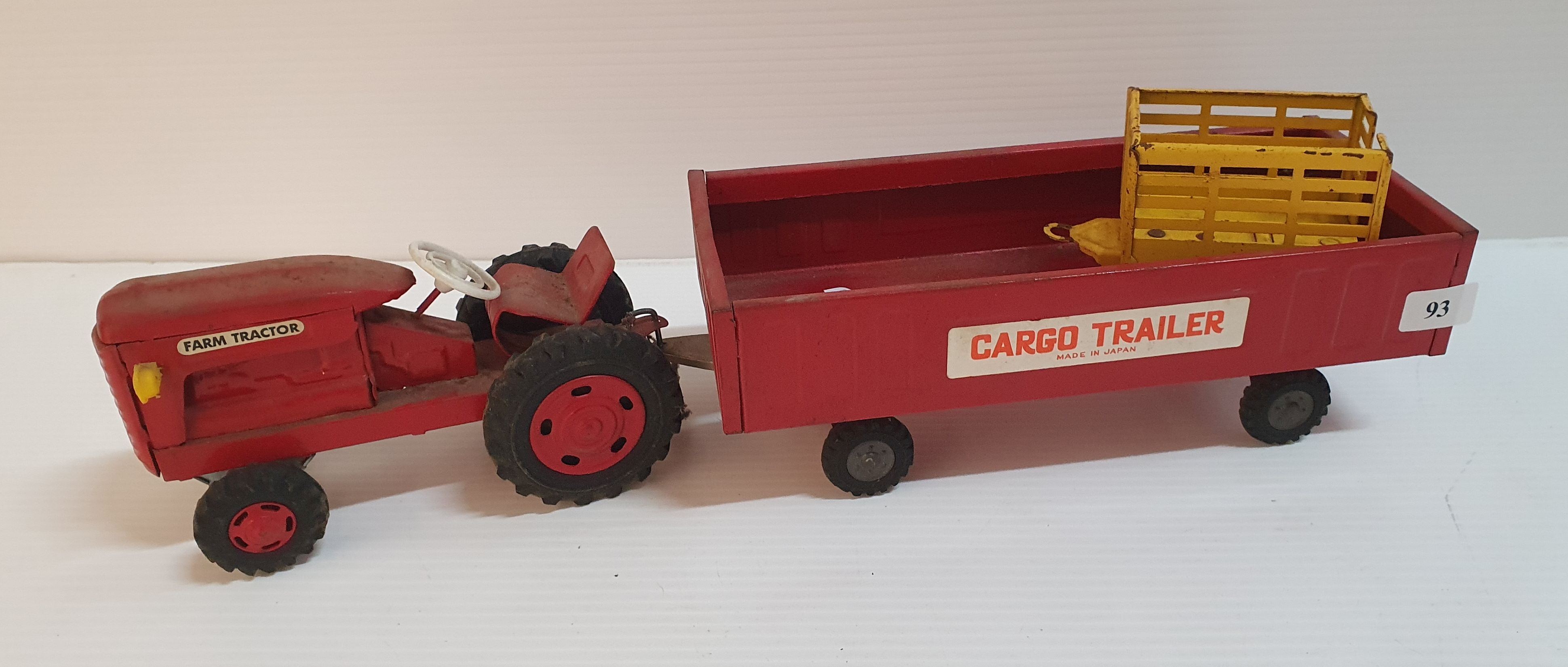 93 · A JAPANESE MADE TIN 'TRACTOR AND TRAILER'