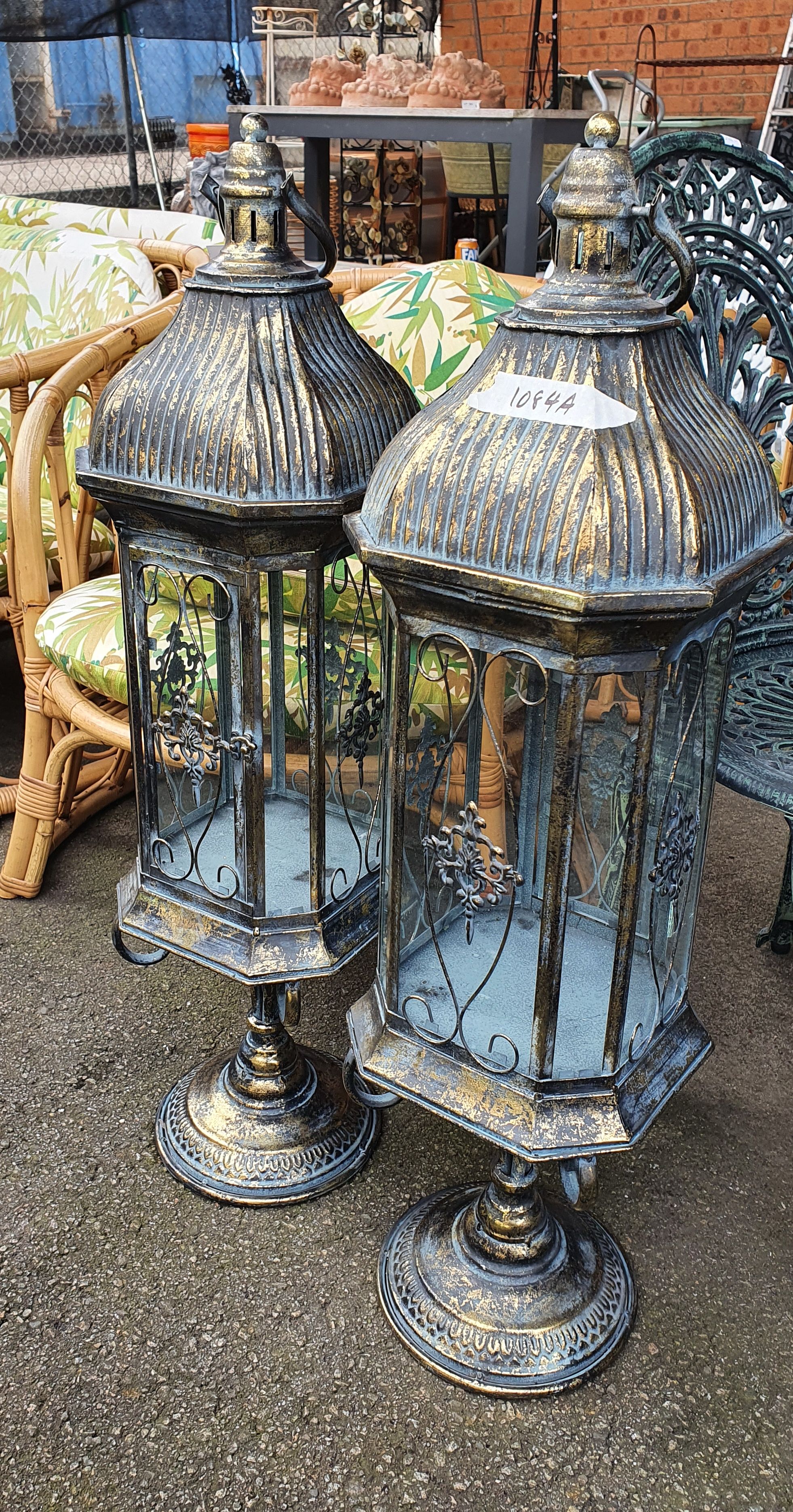 1084A · A PAIR OF DECORATIVE METAL CANDLE HOLDERS
