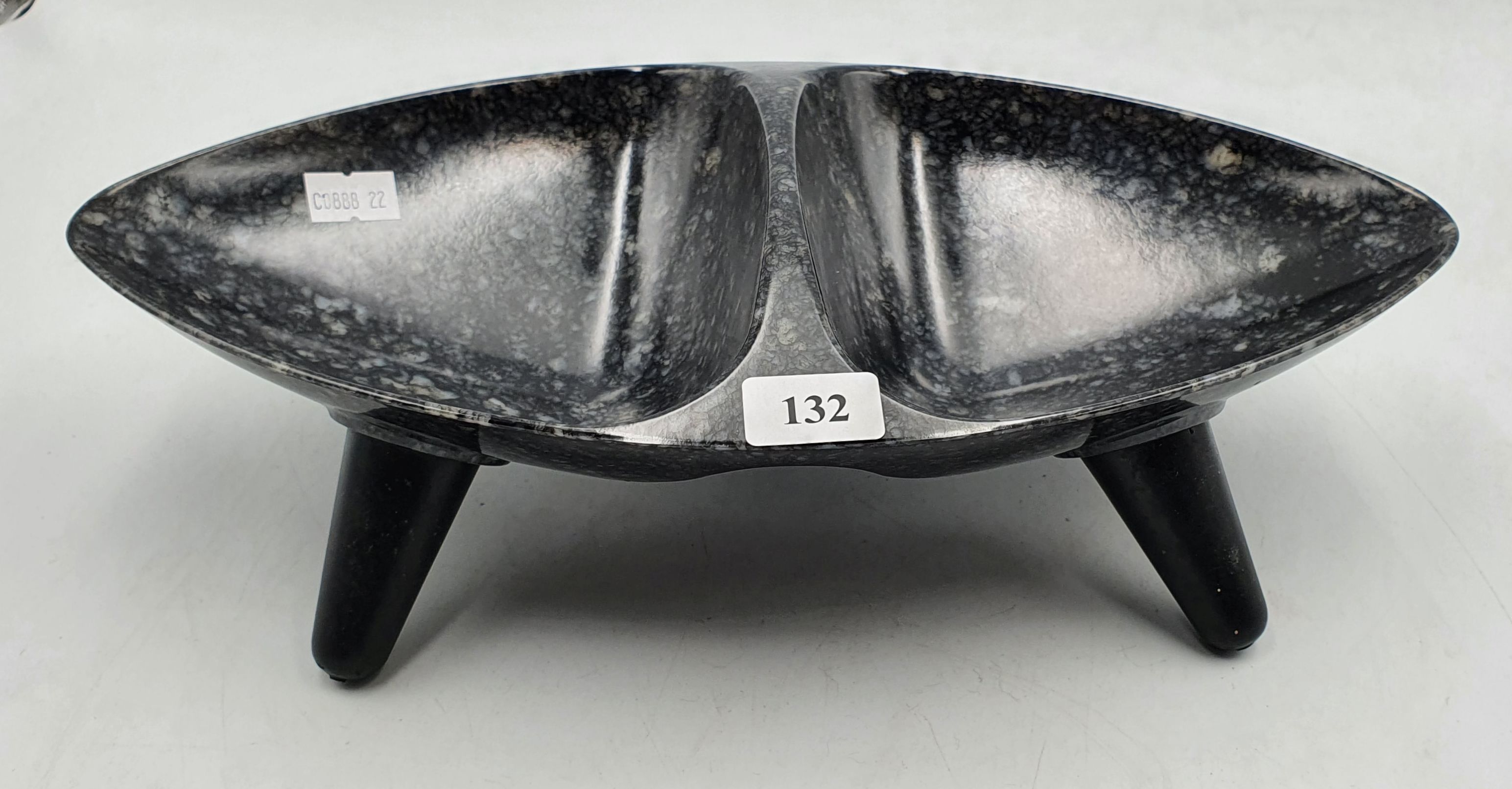 194 · A MID-CENTURY STYLE DIVIDED DISH RAISED ON FOUR LEGS