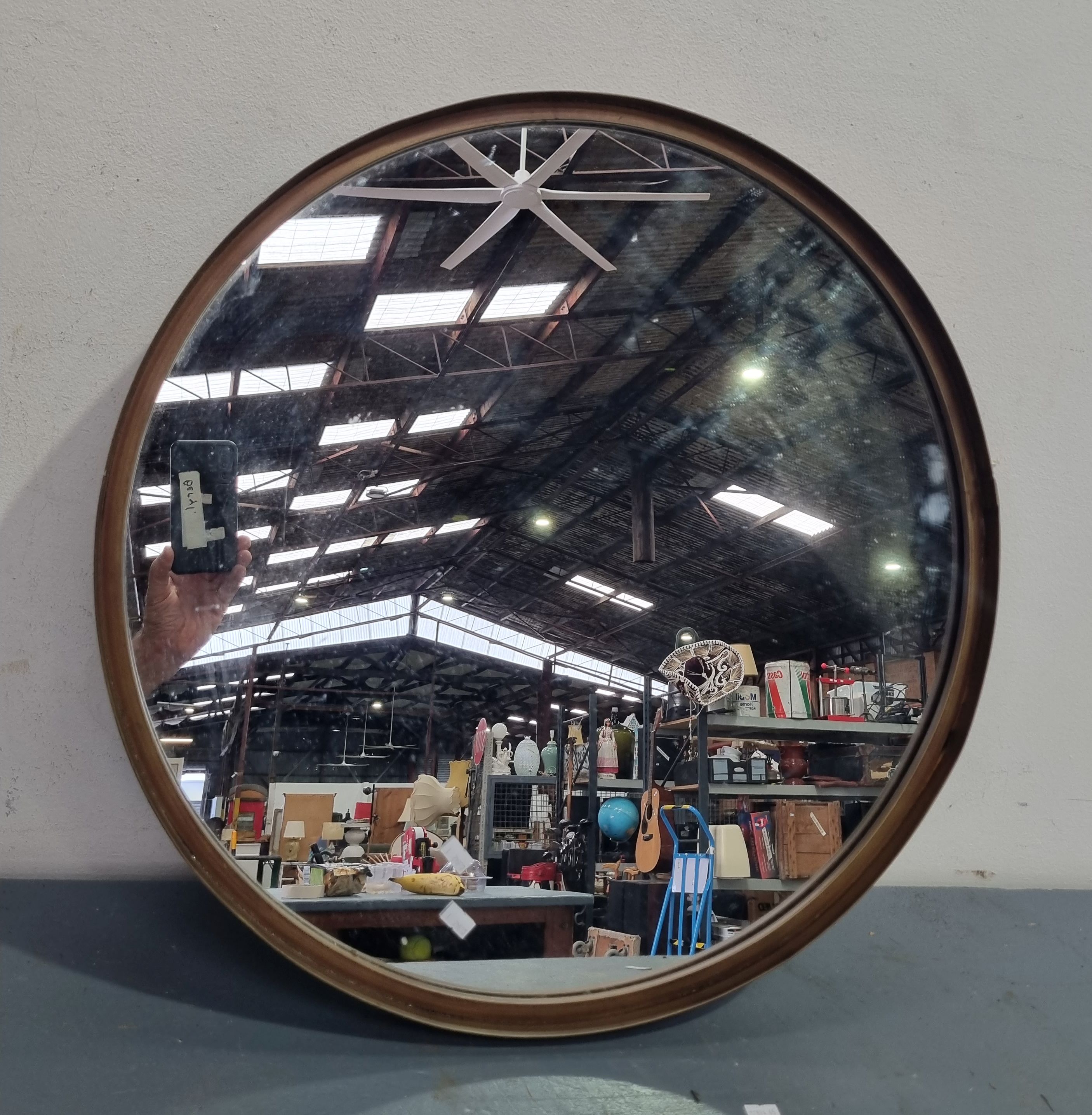 A Round Metal Frame Mirror