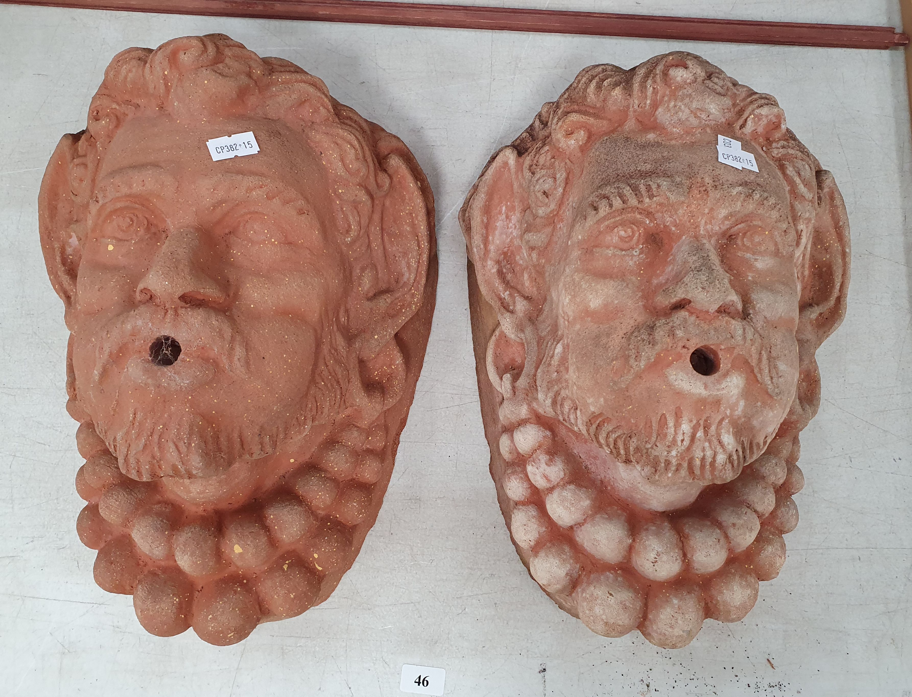 46 · TWO TERRACOTTA FOUNTAIN MASKS