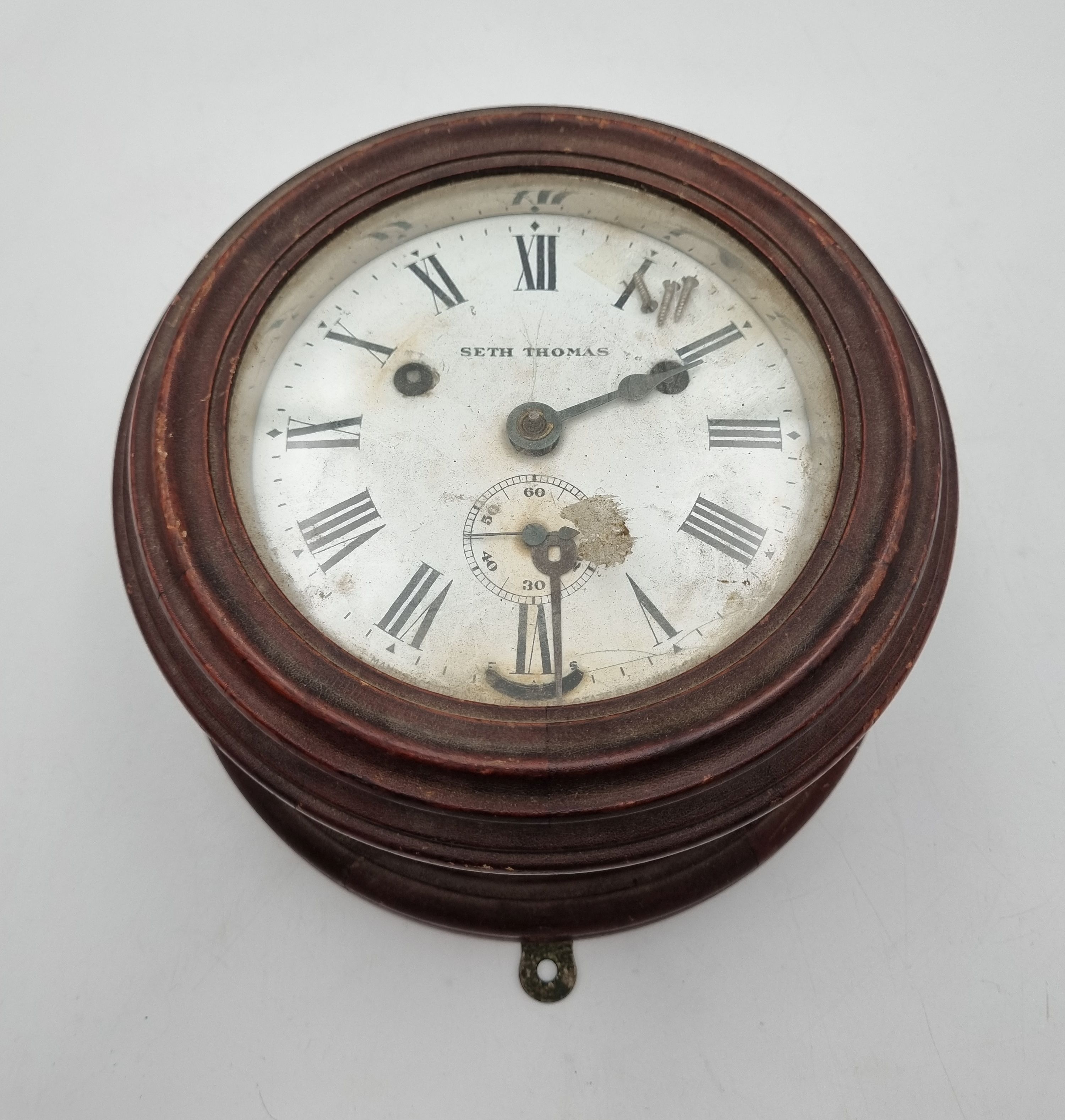 587 · A LATE 19TH CENTURY AMERICAN MAHOGANY SHIP'S STRIKE BULKHEAD CLOCK
