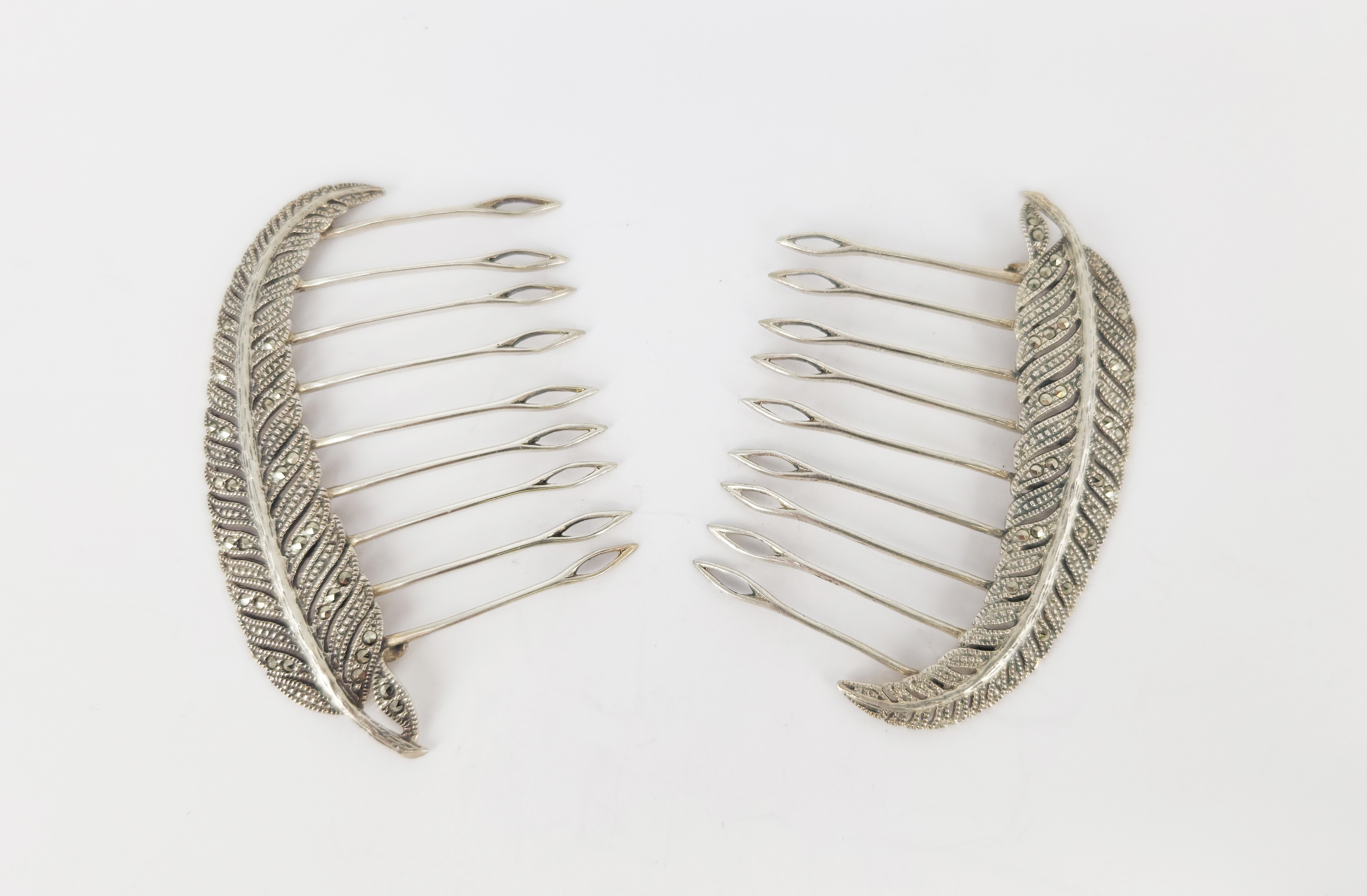 329 · A PAIR OF SILVER AND MARCASITE HAIR COMBS