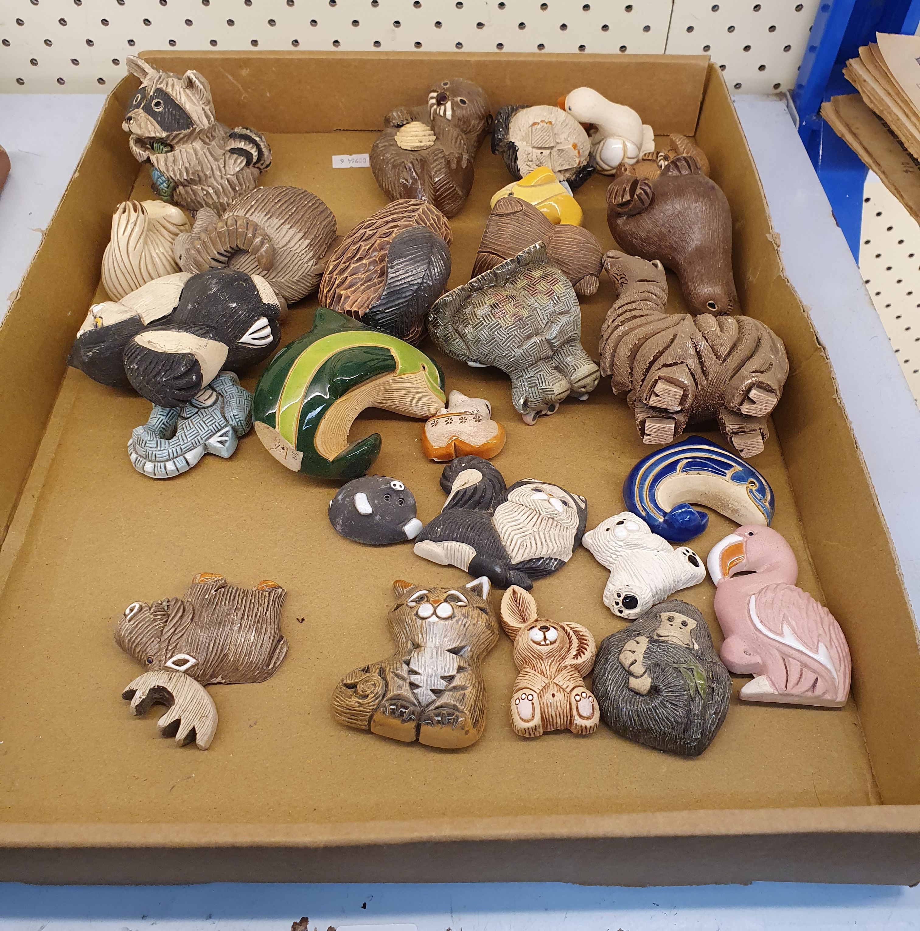 A Box Of Handmade Ceramic Ornaments And Magnets From Uruguay