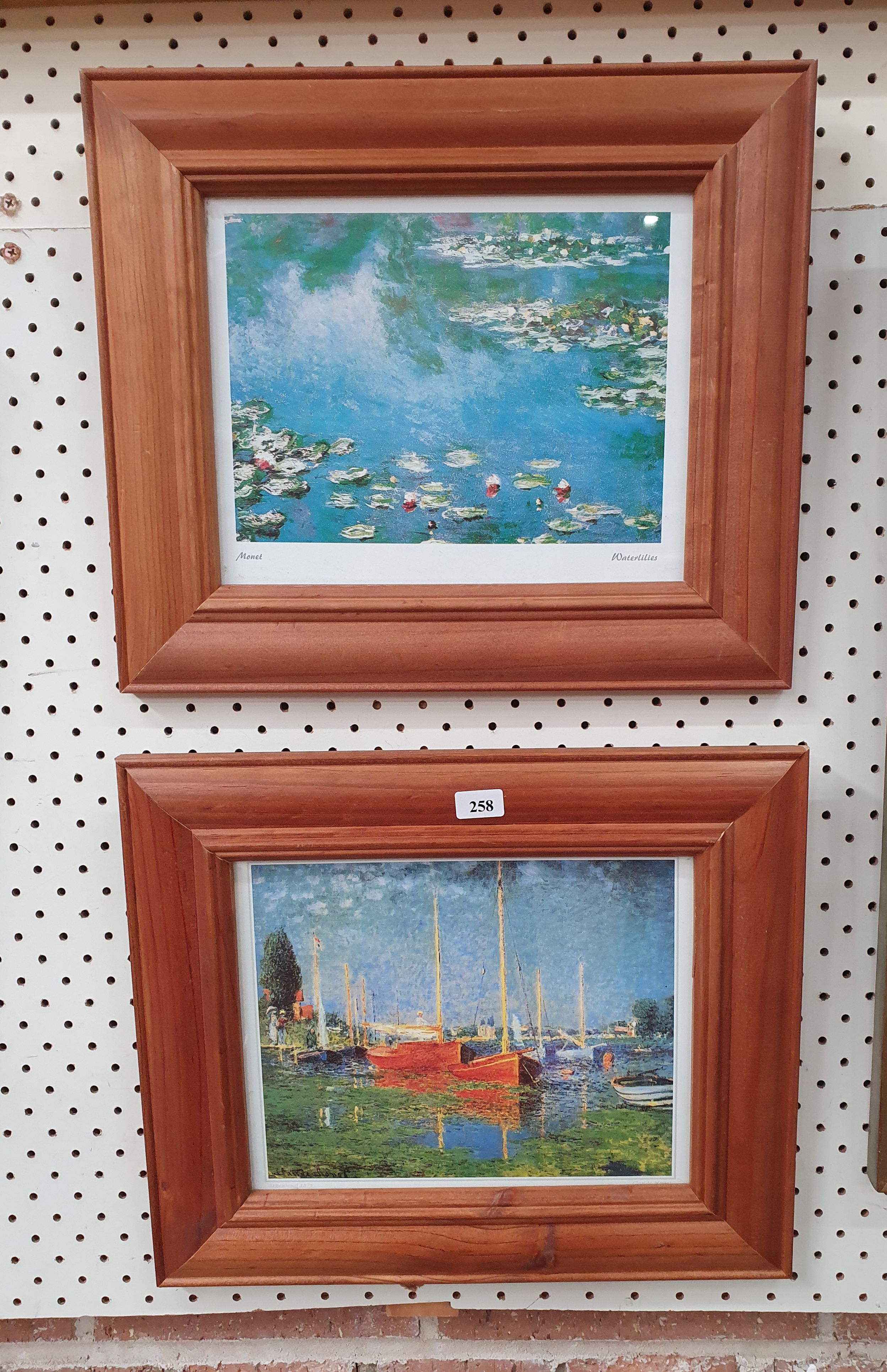 258 · A PAIR OF PRINTS IN WOODEN FRAMES