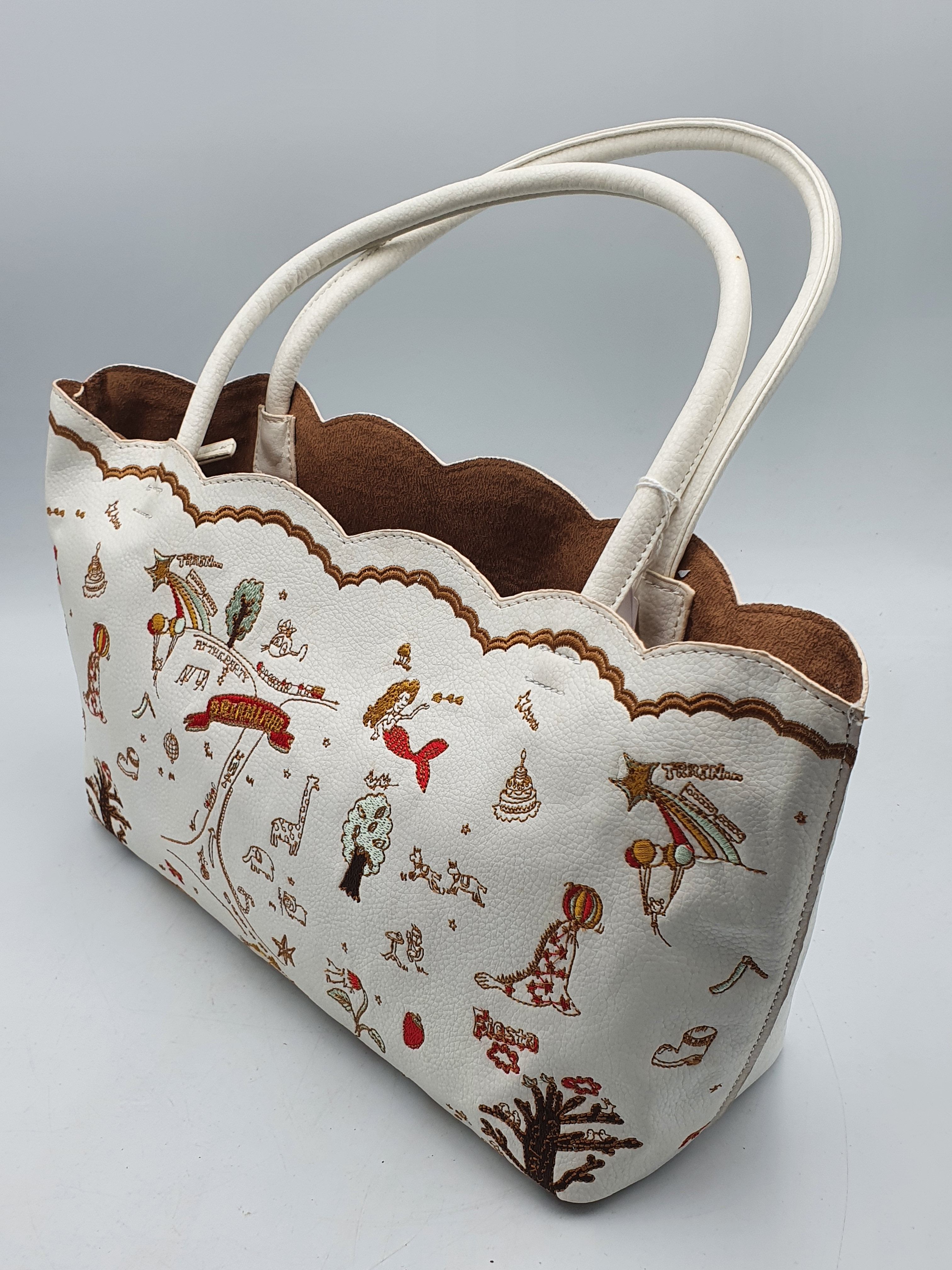 230 · A HANDBAG WITH EMBROIDERED FUN MOTIFS