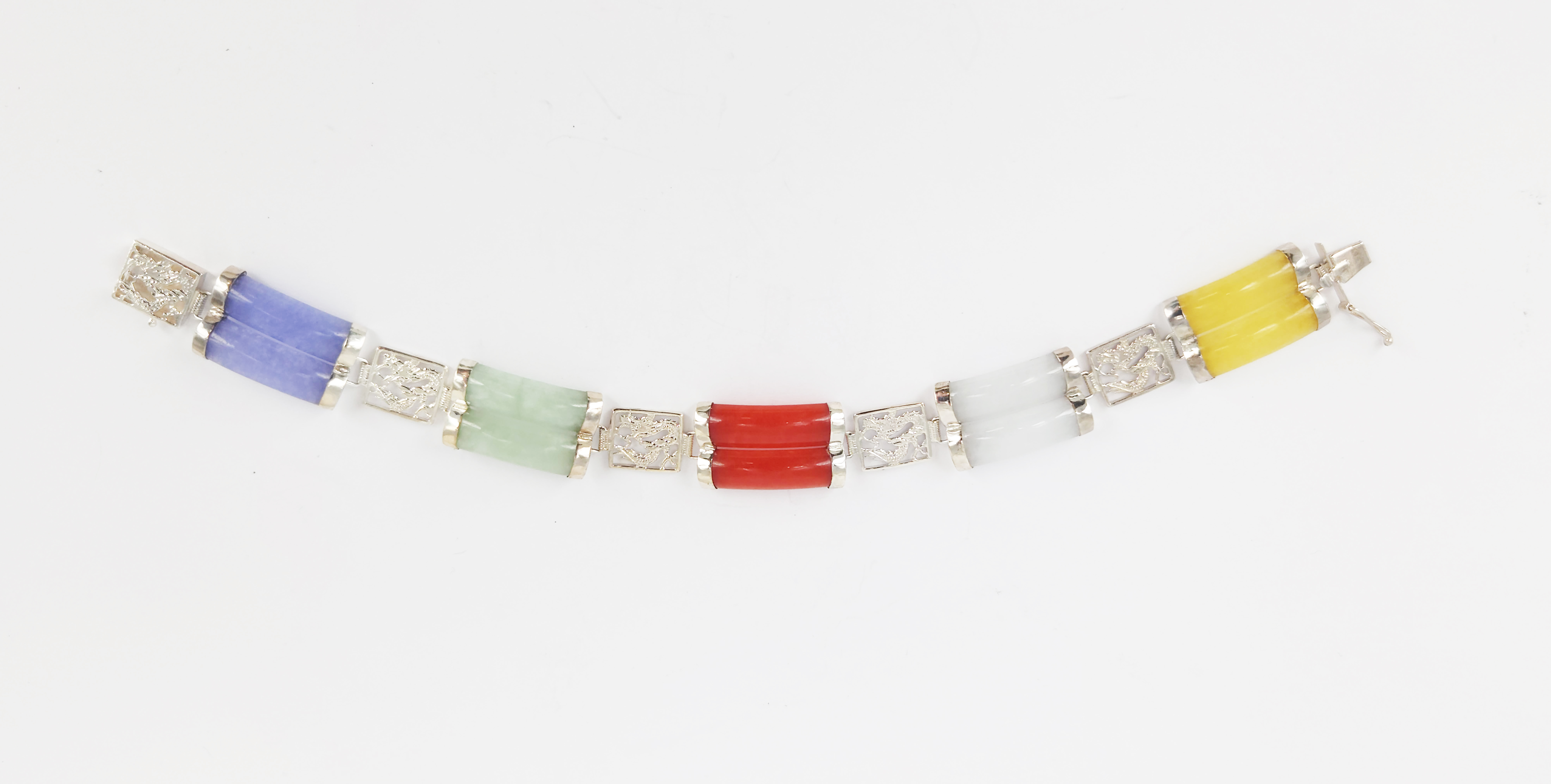 320 · A VINTAGE SILVER AND POLYCHROME JADE BRACELET
