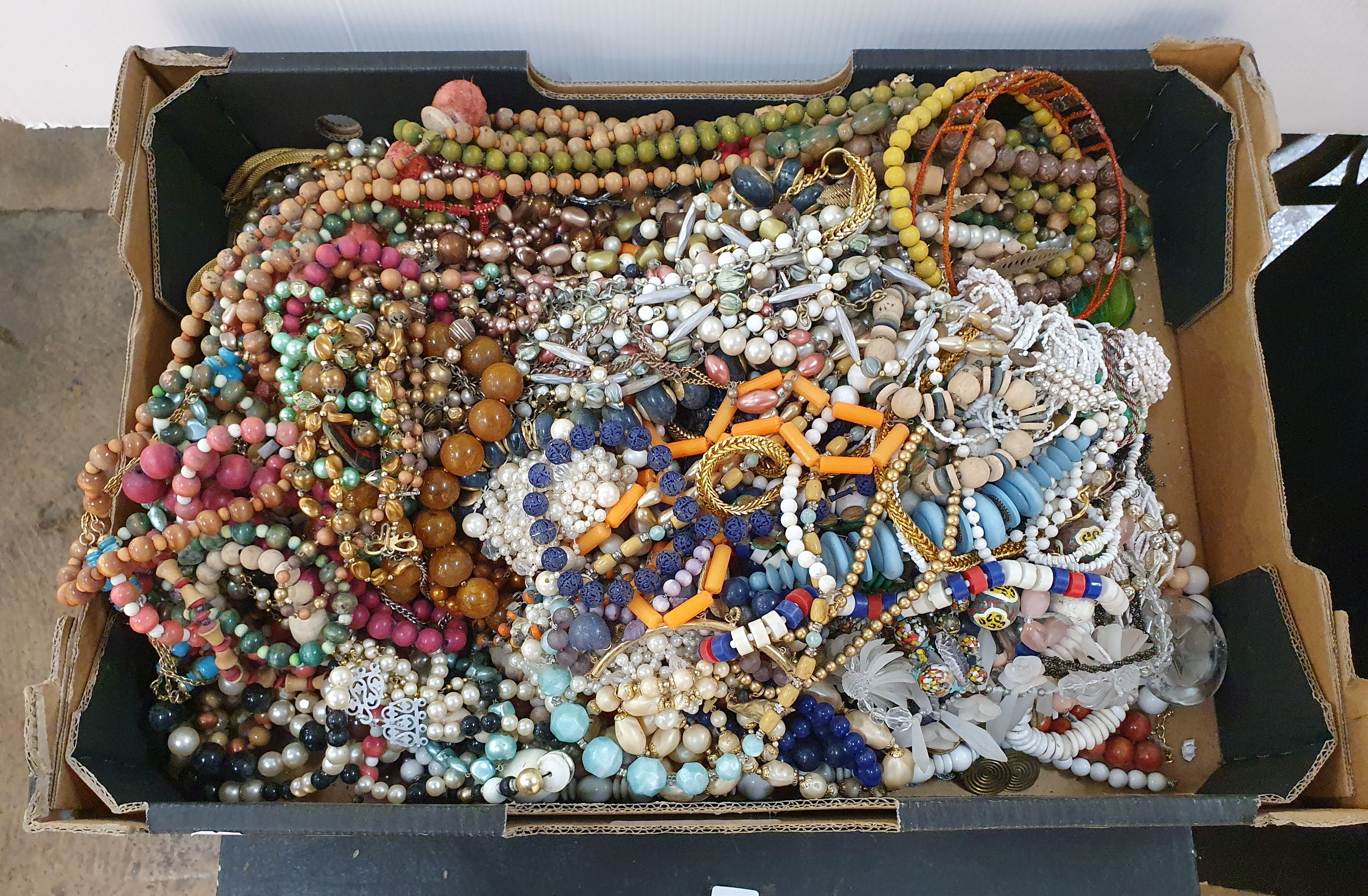 129 · A BOX OF NECKLACES