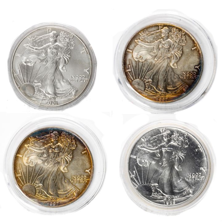 (lot of 4) American Silver Eagles 1989, (2) 1997 (toned), 2001