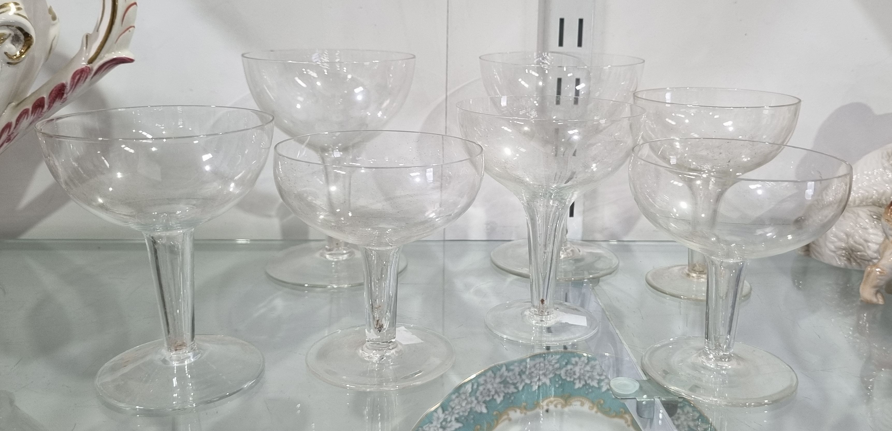 182 · SEVEN VARIOUS VINTAGE HOLLOW STEMMED CHAMPAGNE COUPES