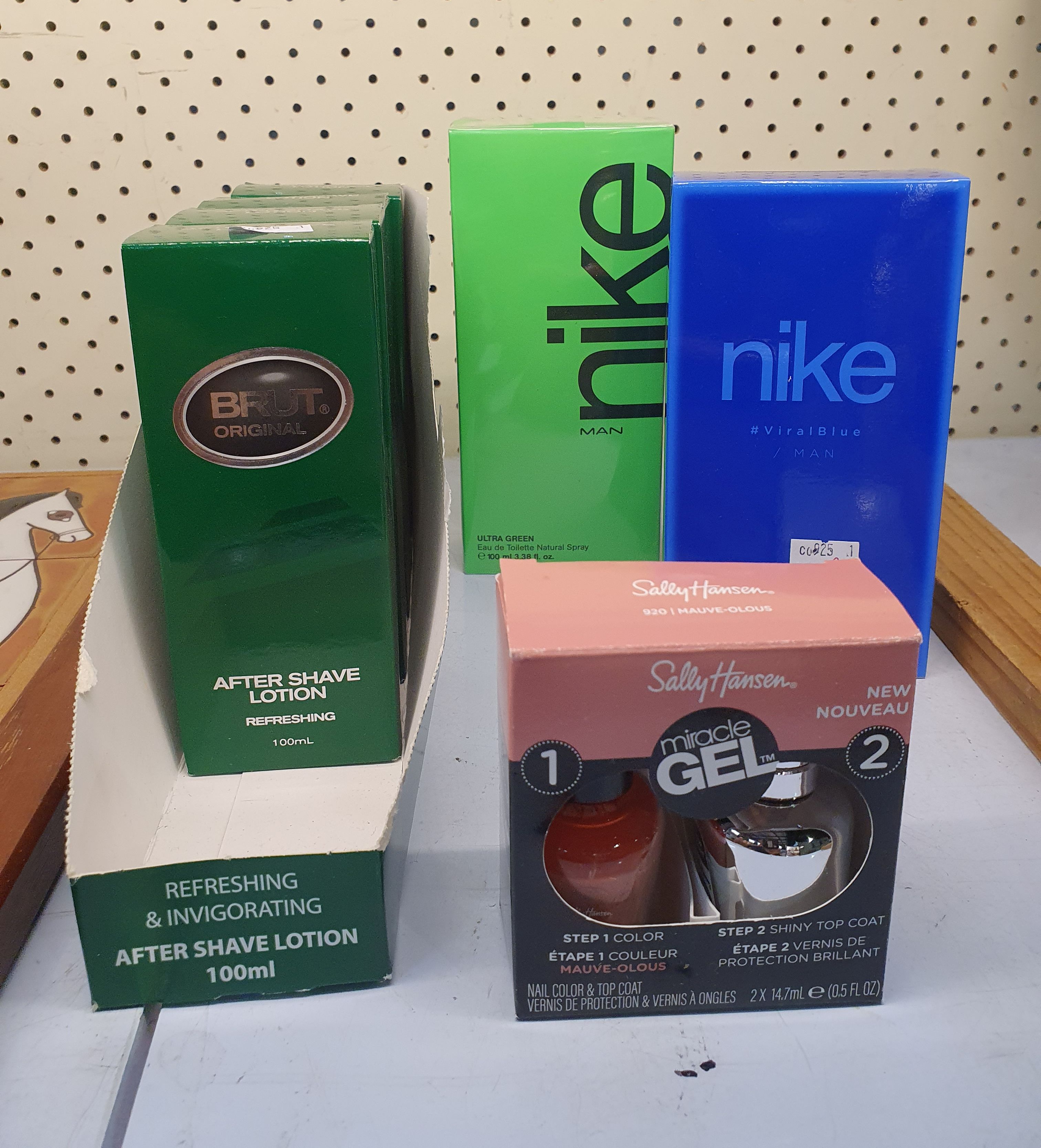 76 · A GROUP OF MENS AFTER SHAVE AND A SALLY HANSEN NAIL KIT