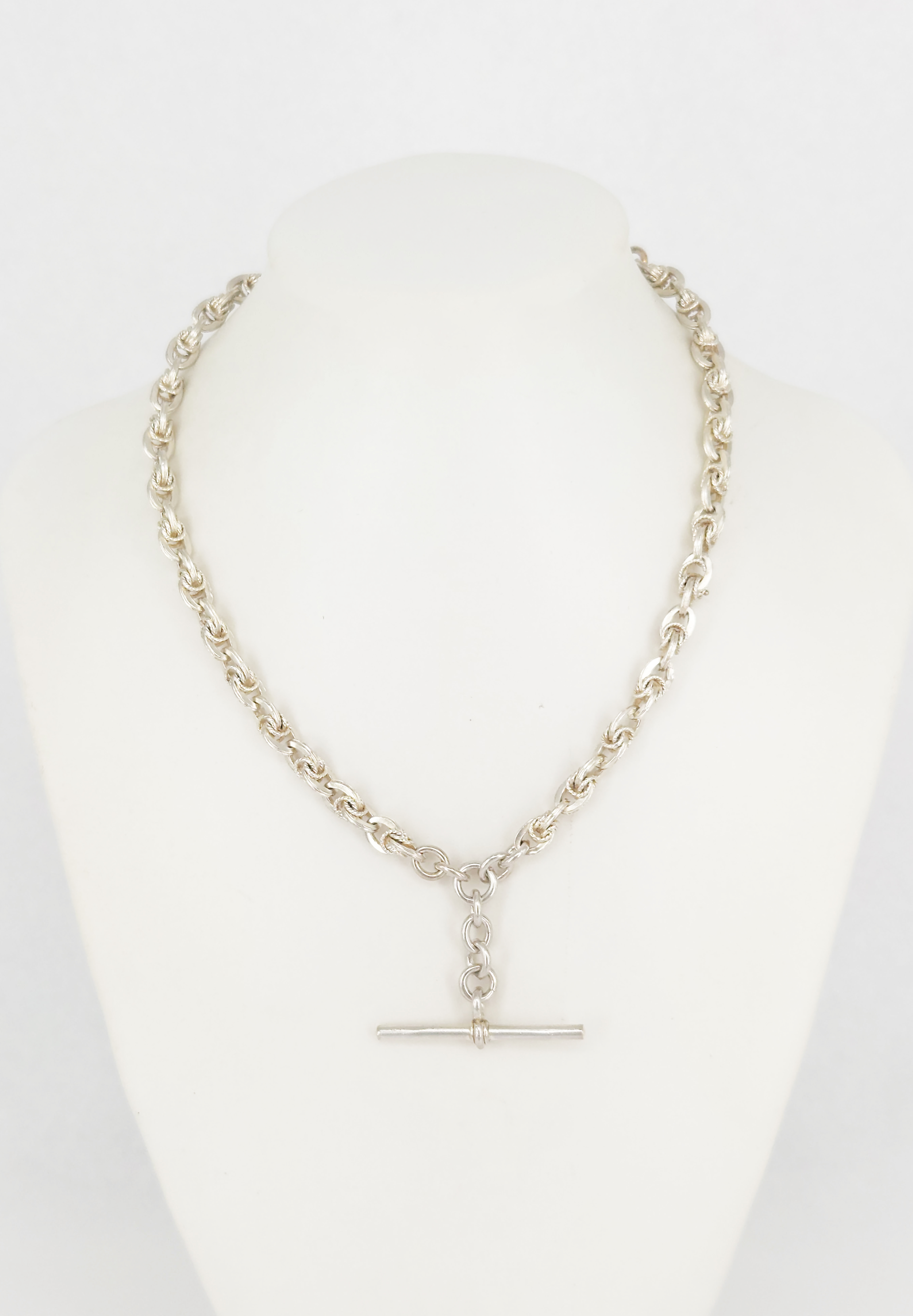 16 · AN EDWARDIAN SILVER FOB CHAIN