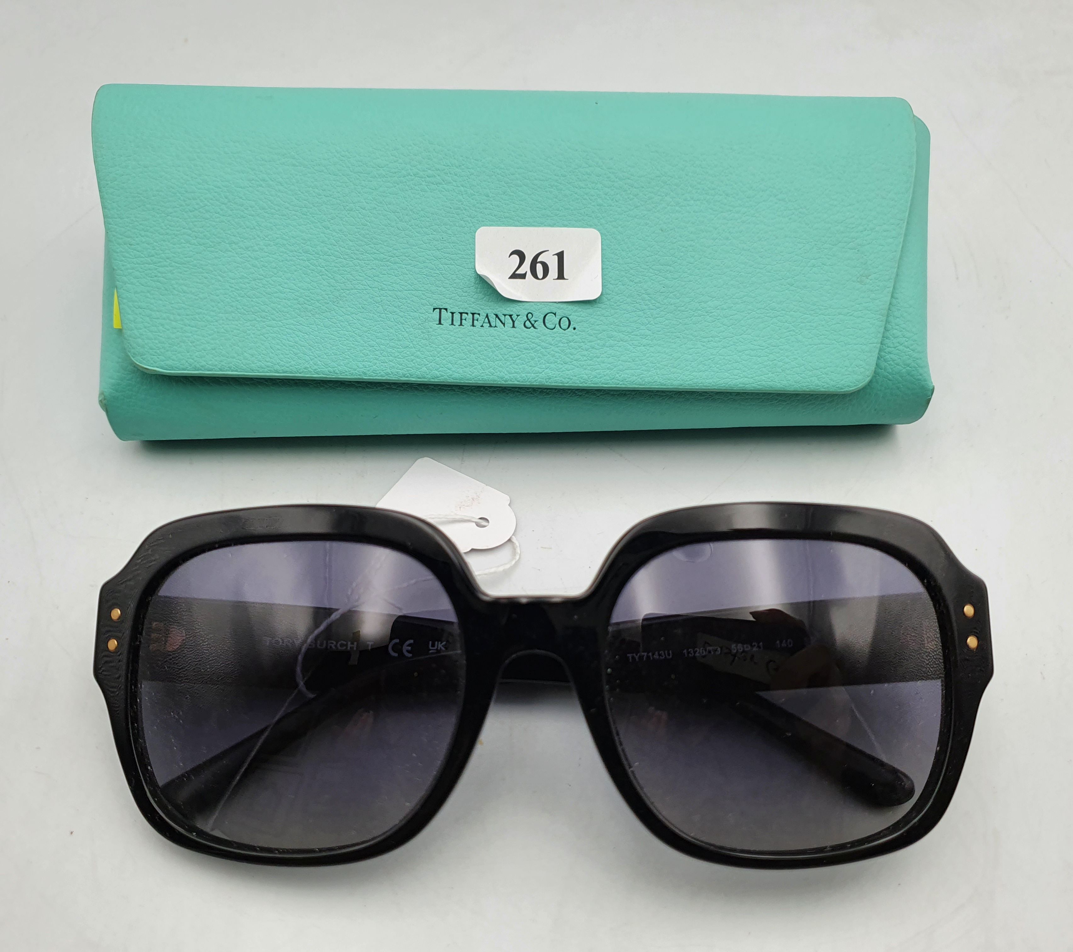 A Pair Of Tiffany Sunglasses And A Case