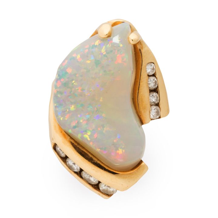 An opal, diamond and fourteen karat gold ring