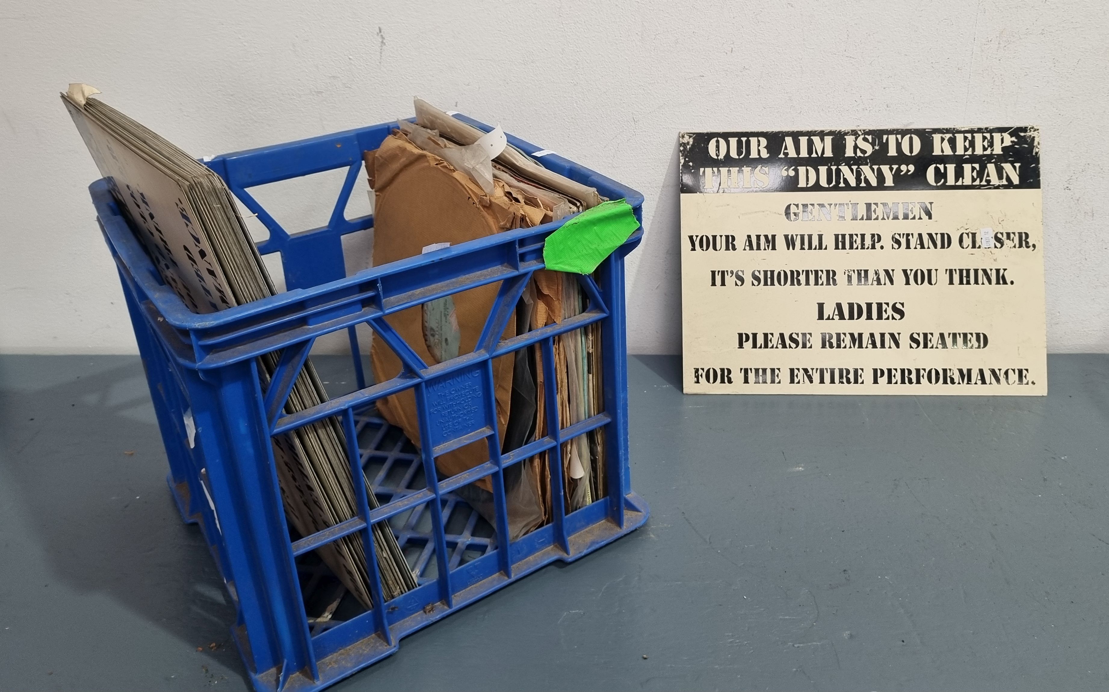 A Crate Of Metal Signs