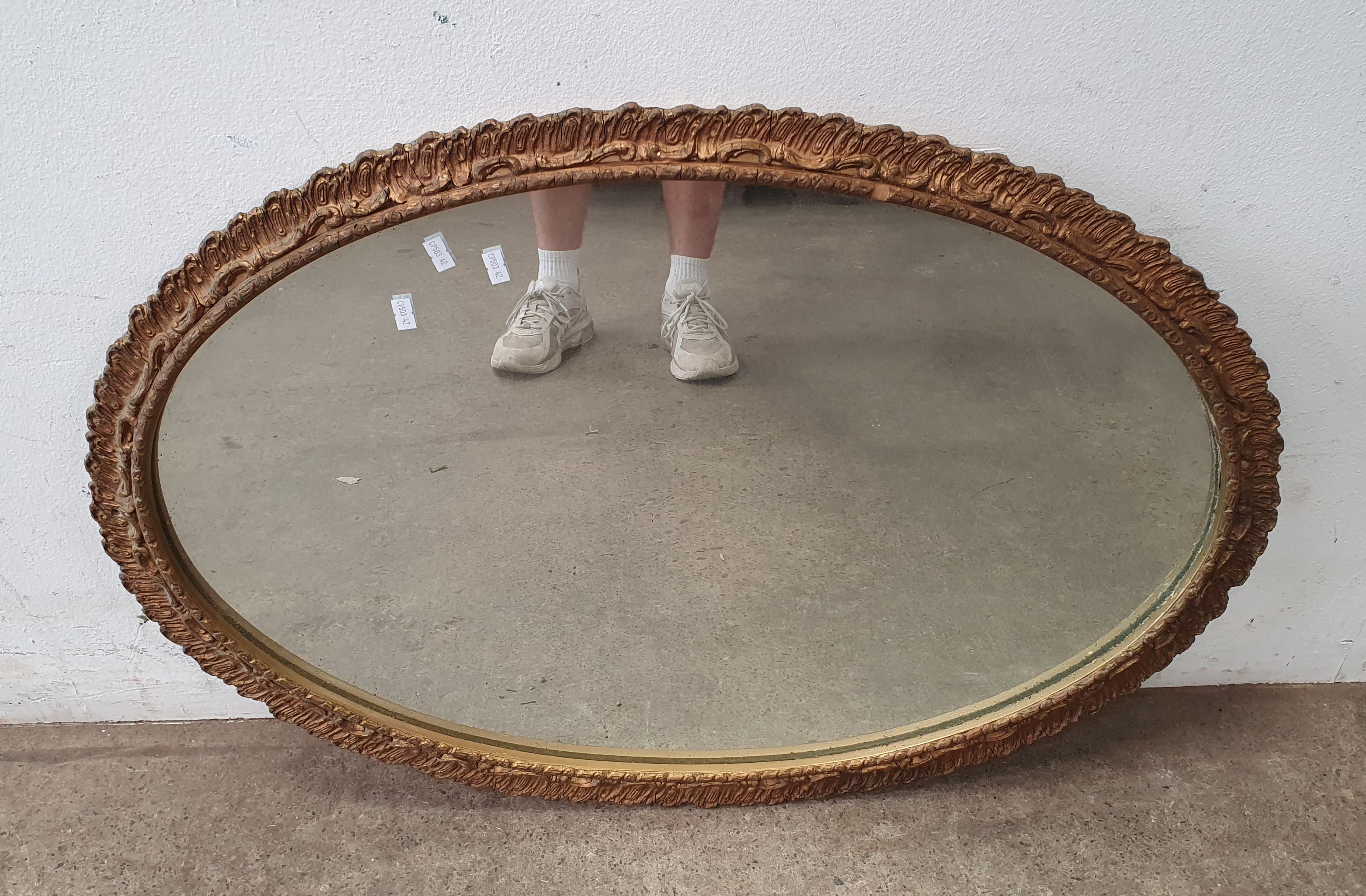 A Gilt Framed Oval Mirror