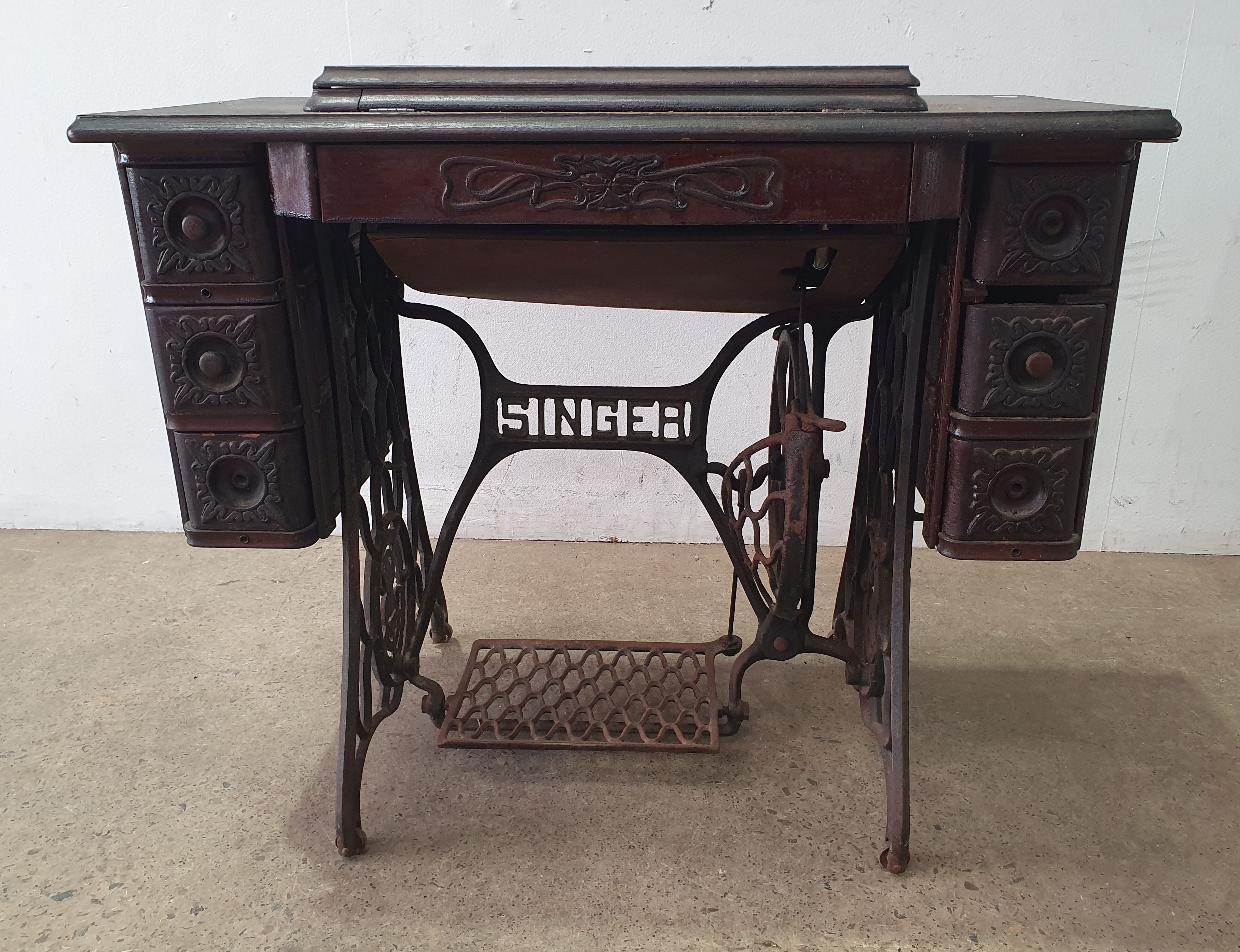 A SINGER TREADLE SEWING MACHINE