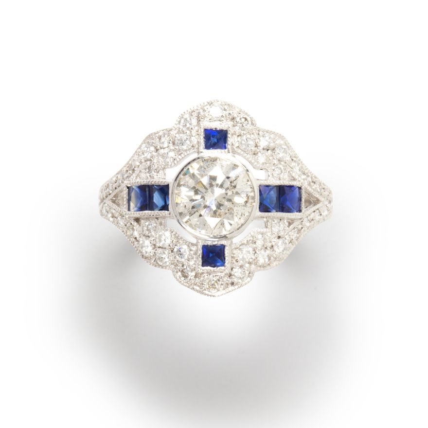 A diamond, sapphire and platinum ring