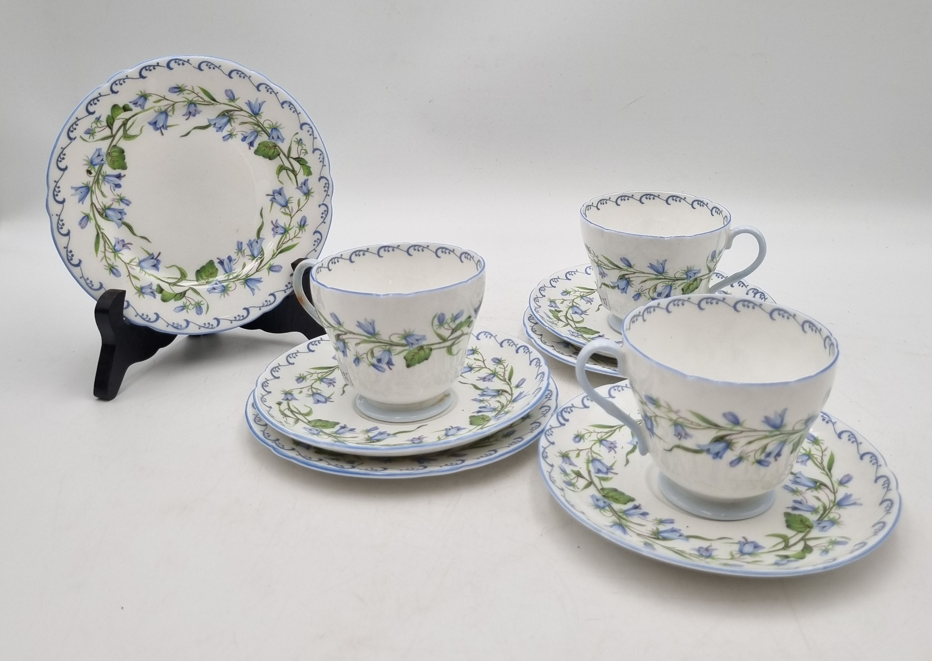 610 · THREE SHELLEY FINE BONE CHINA "HAREBELL" TEA TRIOS