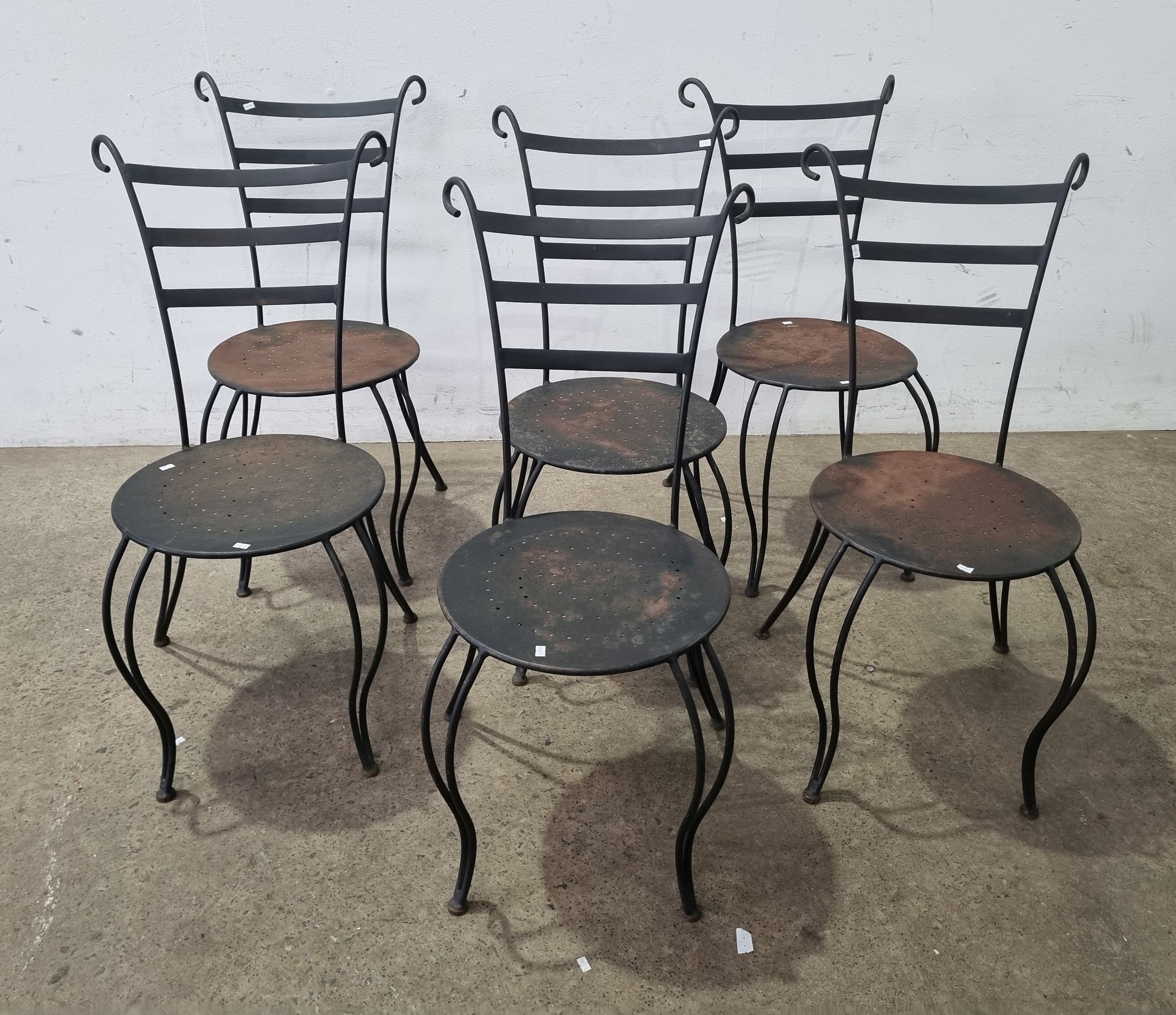 A Set Of Six Wrought Iron Outdoor Chairs