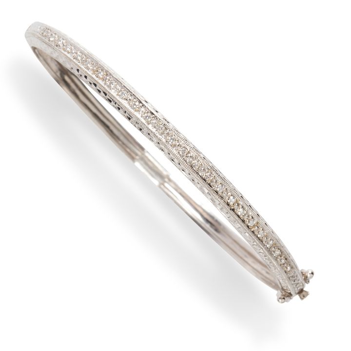 A diamond and eighteen karat white gold bracelet
