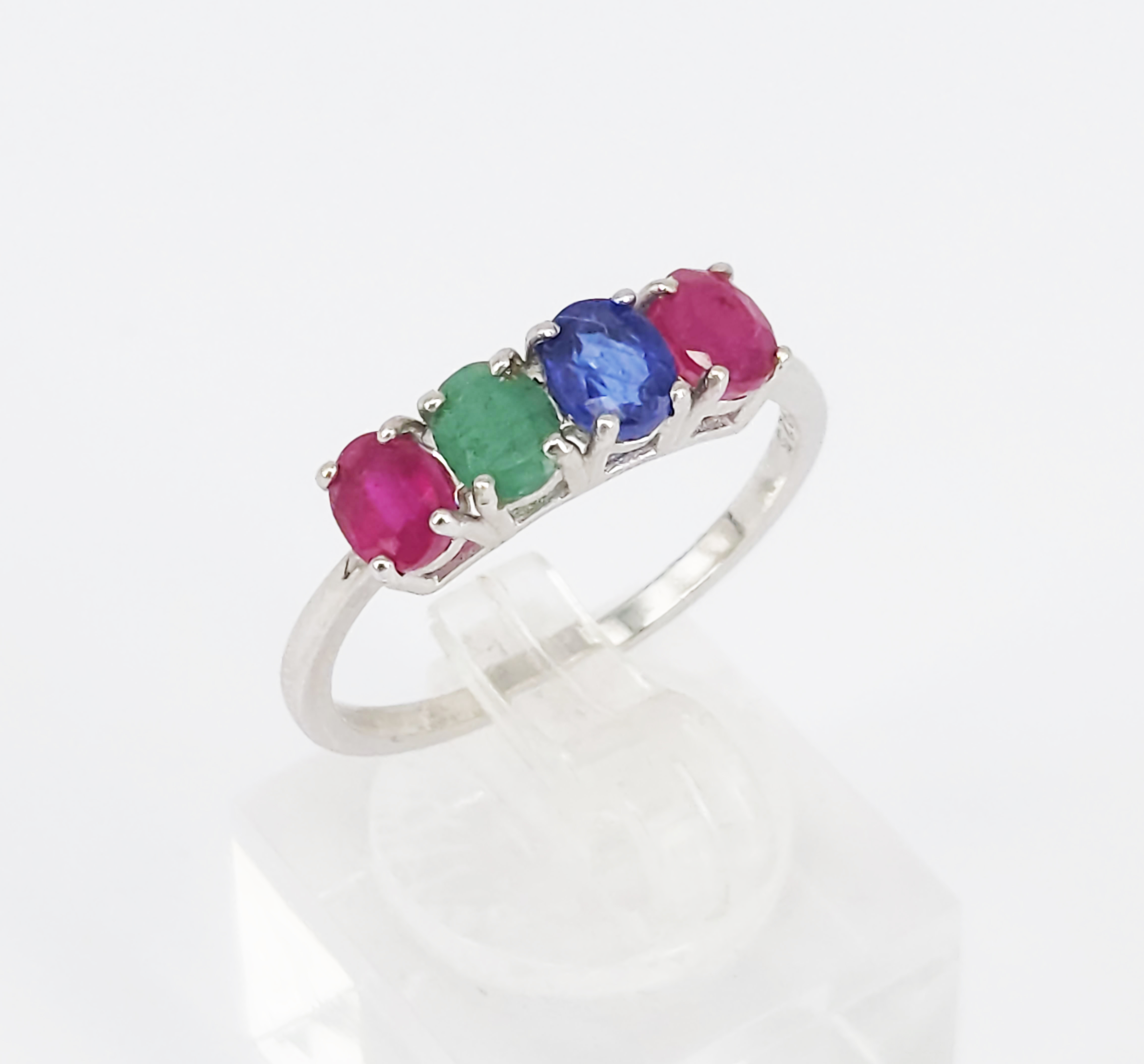 226 · A SILVER AND FOUR STONE RING