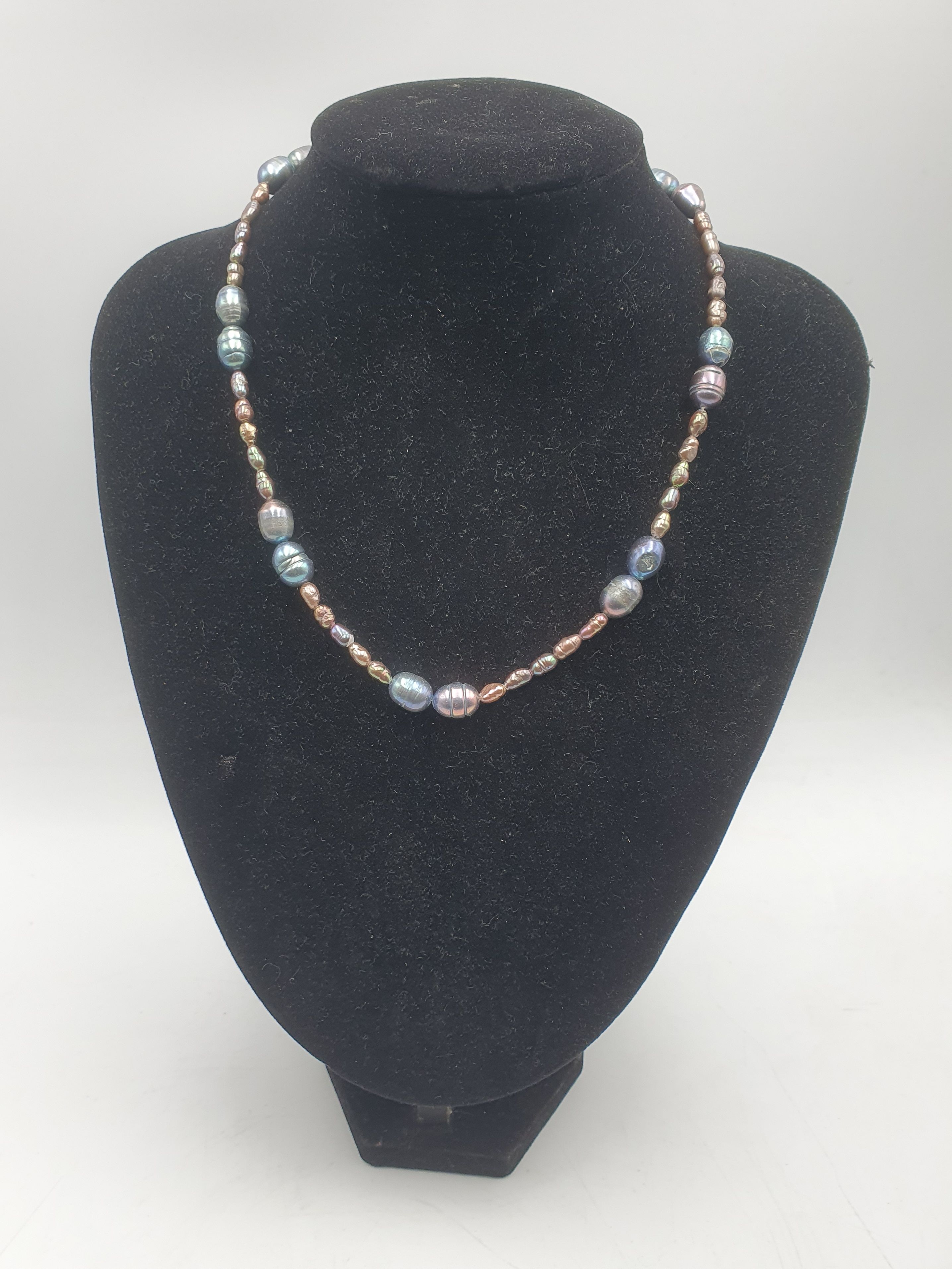 A Cultured Black Pearl Necklace With Silver Clasp