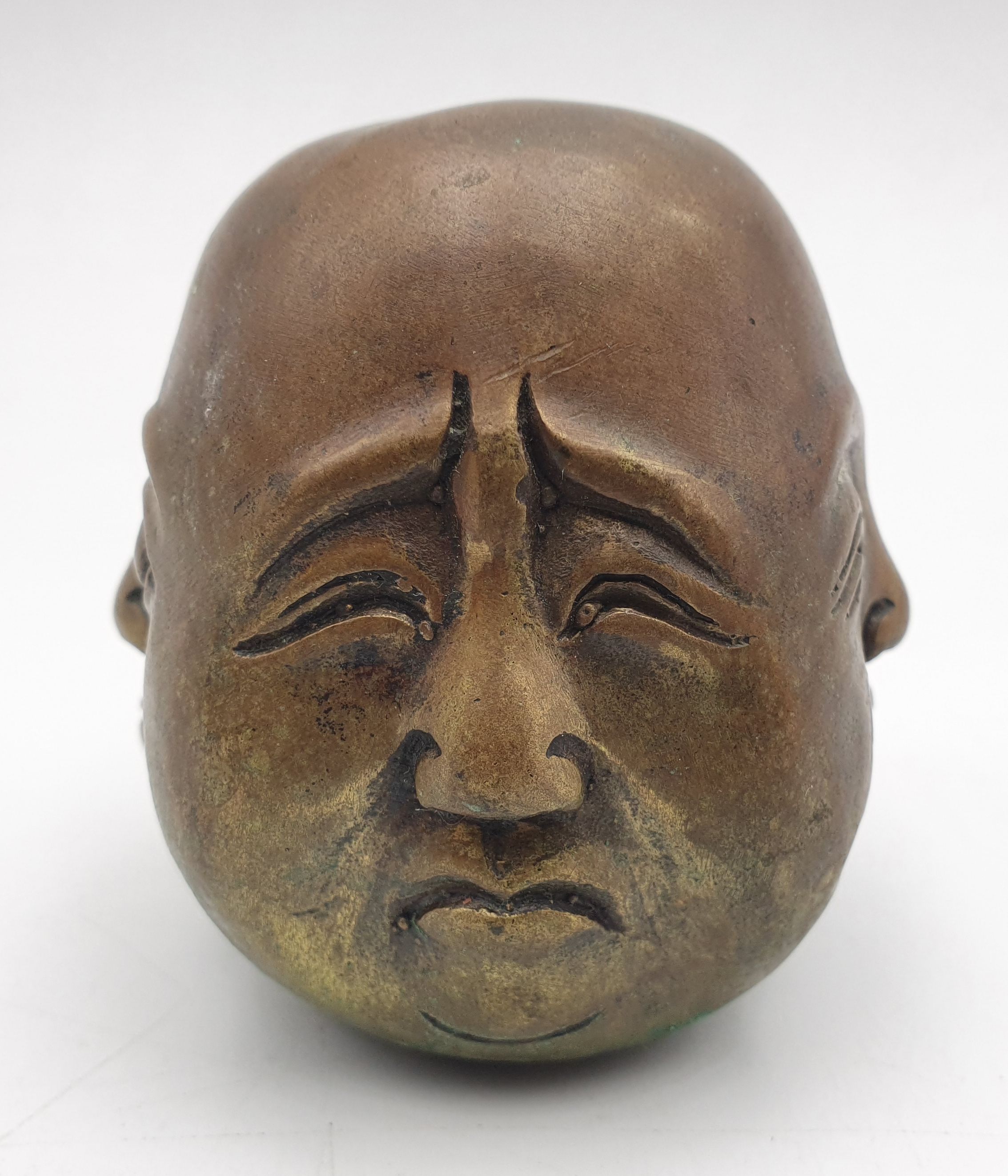 271 · A BRASS HEAD WITH FOUR FACES