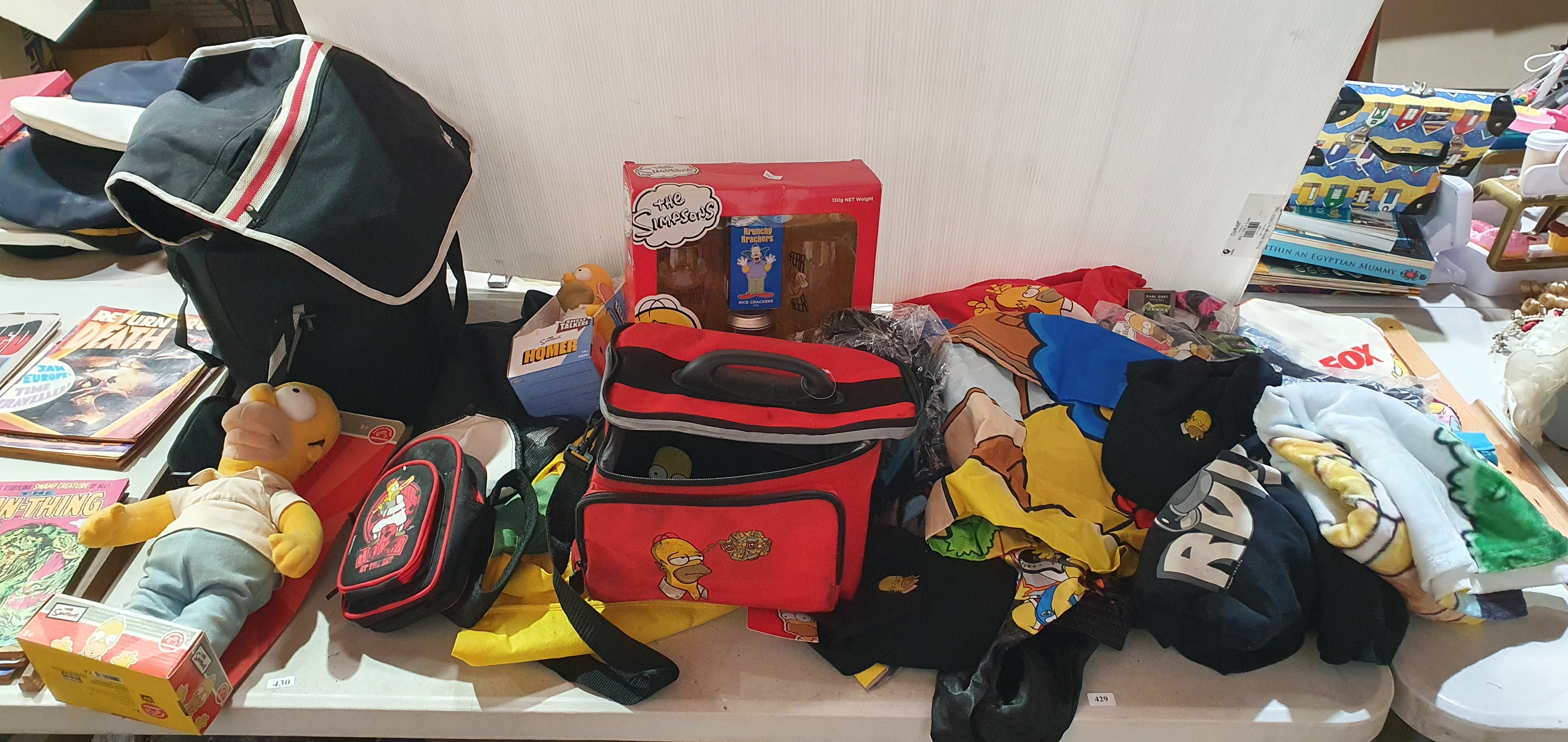 429 · TWO LARGE BOXES OF SIMPSONS TOYS AND T-SHIRTS ETC